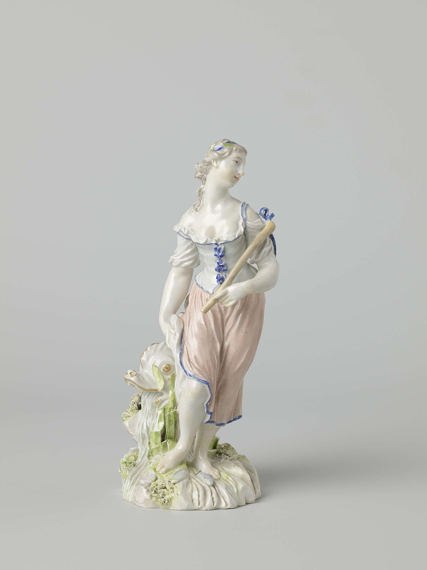 Figure of a woman with fish by Porseleinfabriek Ludwigsburg