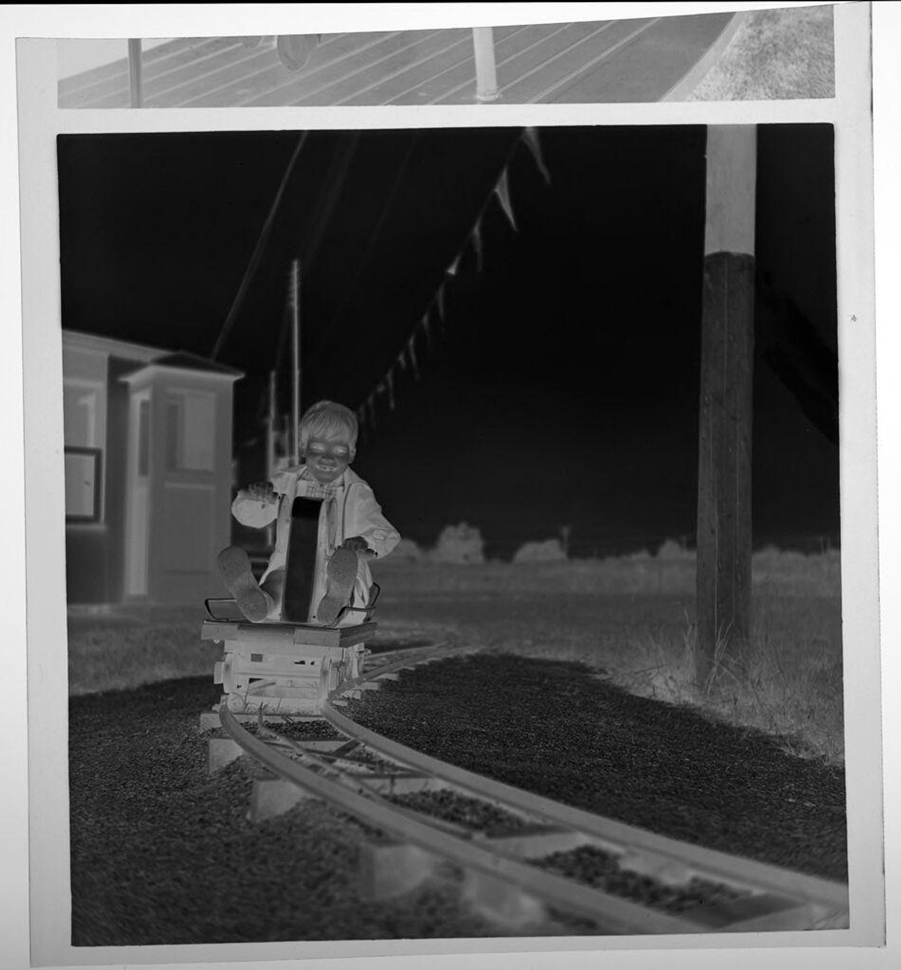 Untitled (children on boat ride at amusement park) by Jack Gould