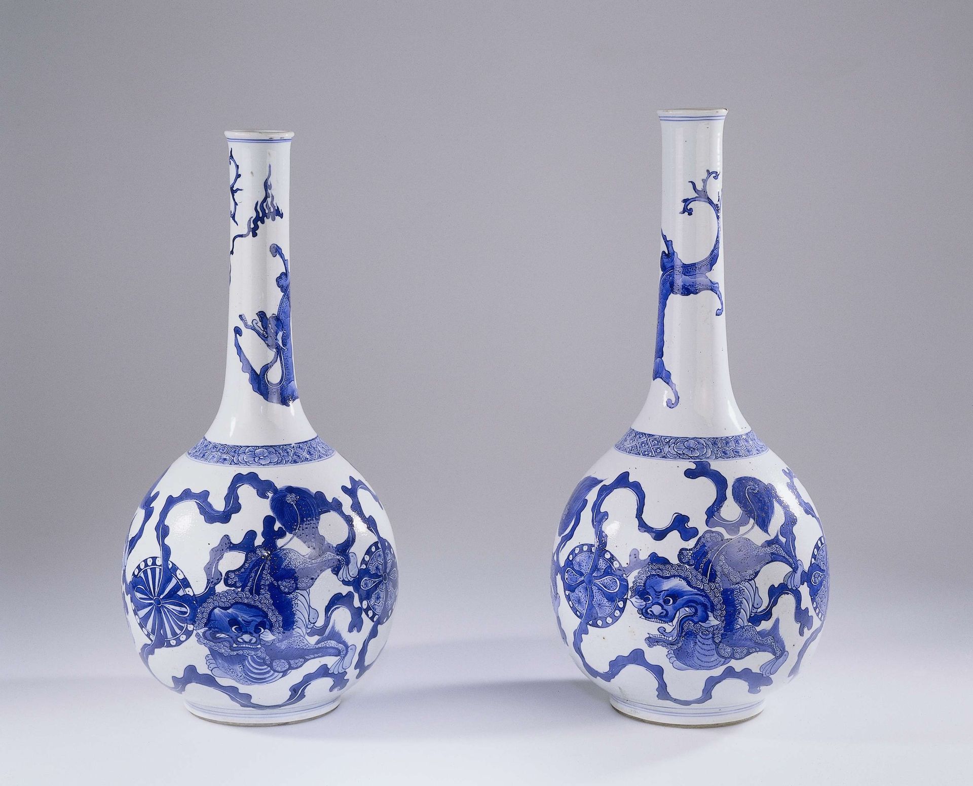 Bottle vase with three shishi and a dragon by Anonymous