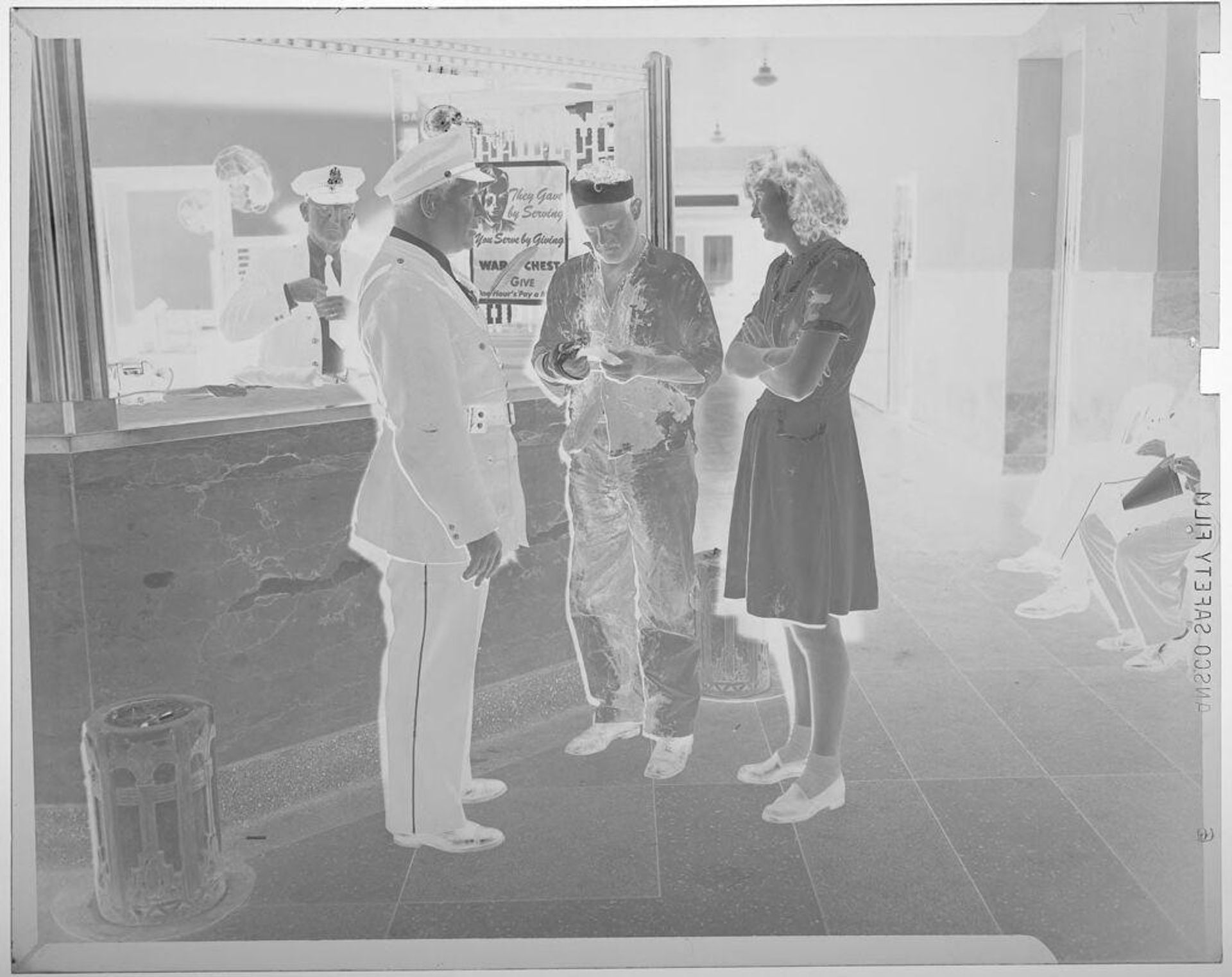 Untitled (man and woman talking to police officer, all are standing) by Jack Gould
