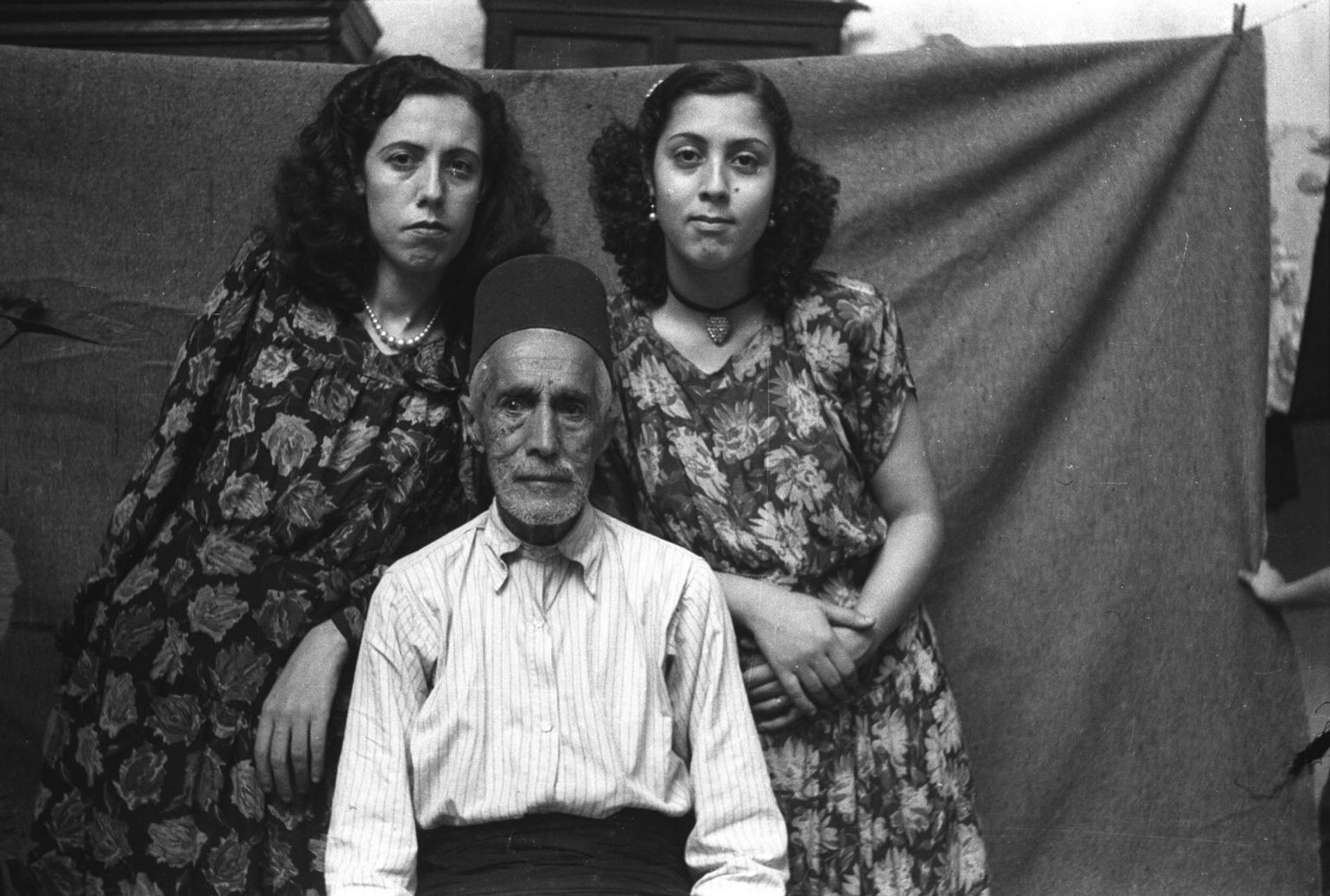 A fisherman with his daughters. Saqqa family house, Saida, Lebanon, 1948-53. Hashem el Madani by  Akram Zaatari