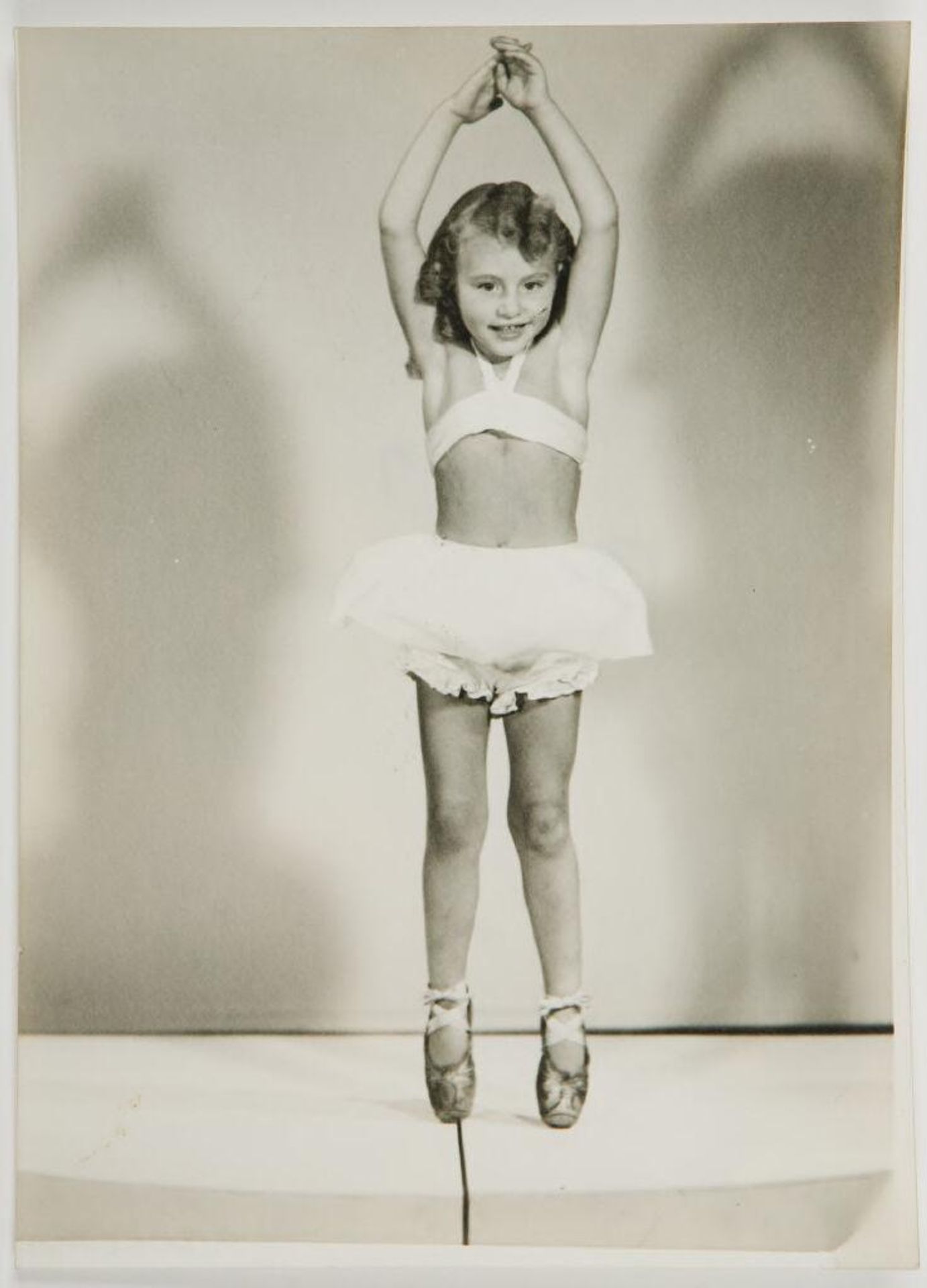 Untitled (little girl posing as ballerina) by Ken Whitmire Associates