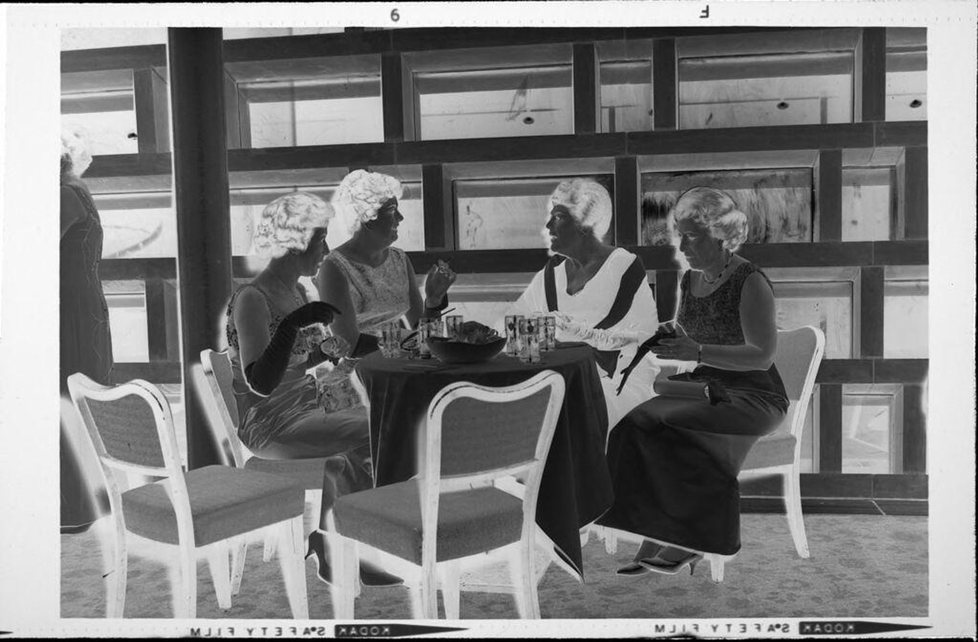 Untitled (women at table at party) by Robert Burian