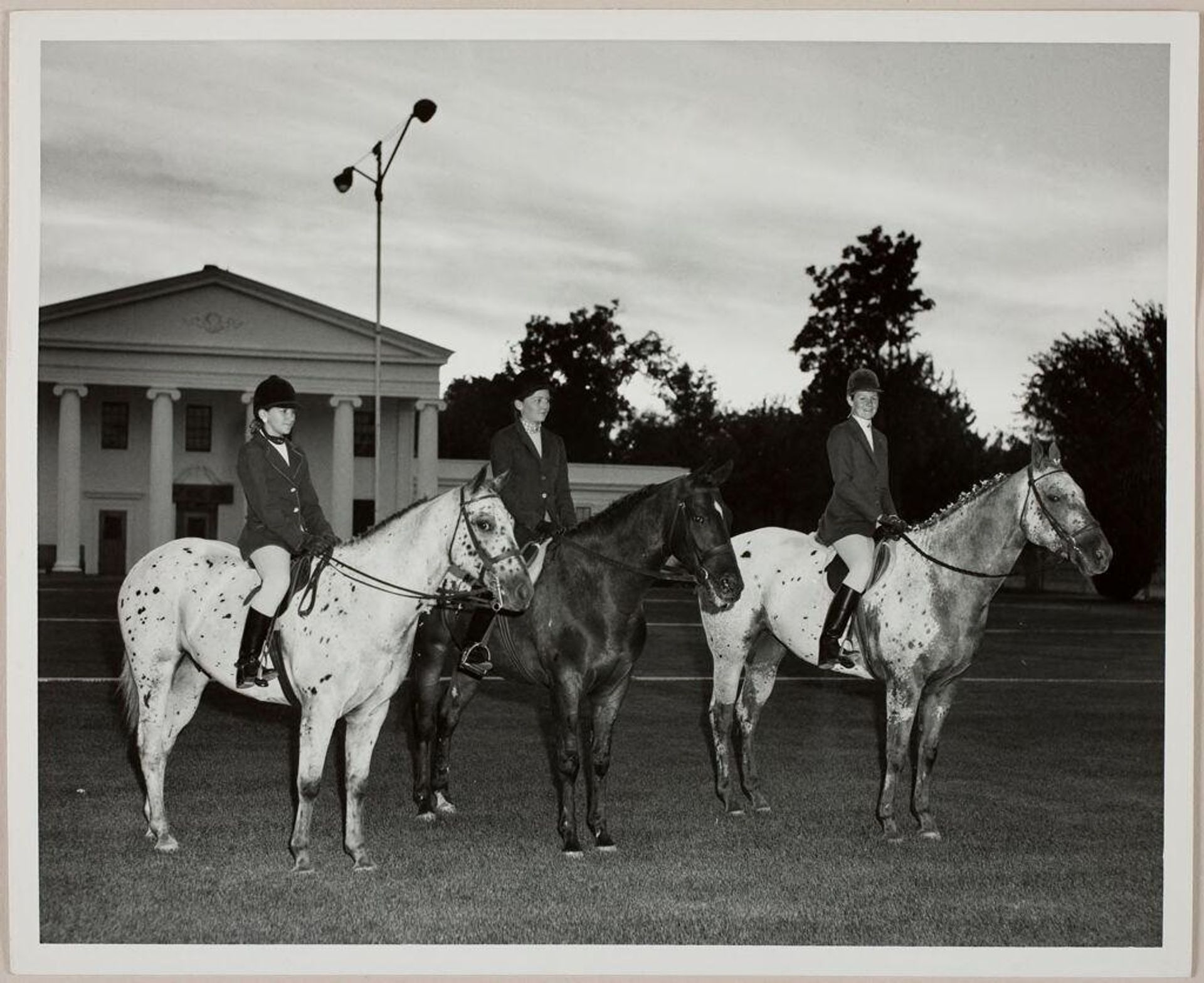 Untitled (three women on horses in riding clothes) by Ken Whitmire Associates
