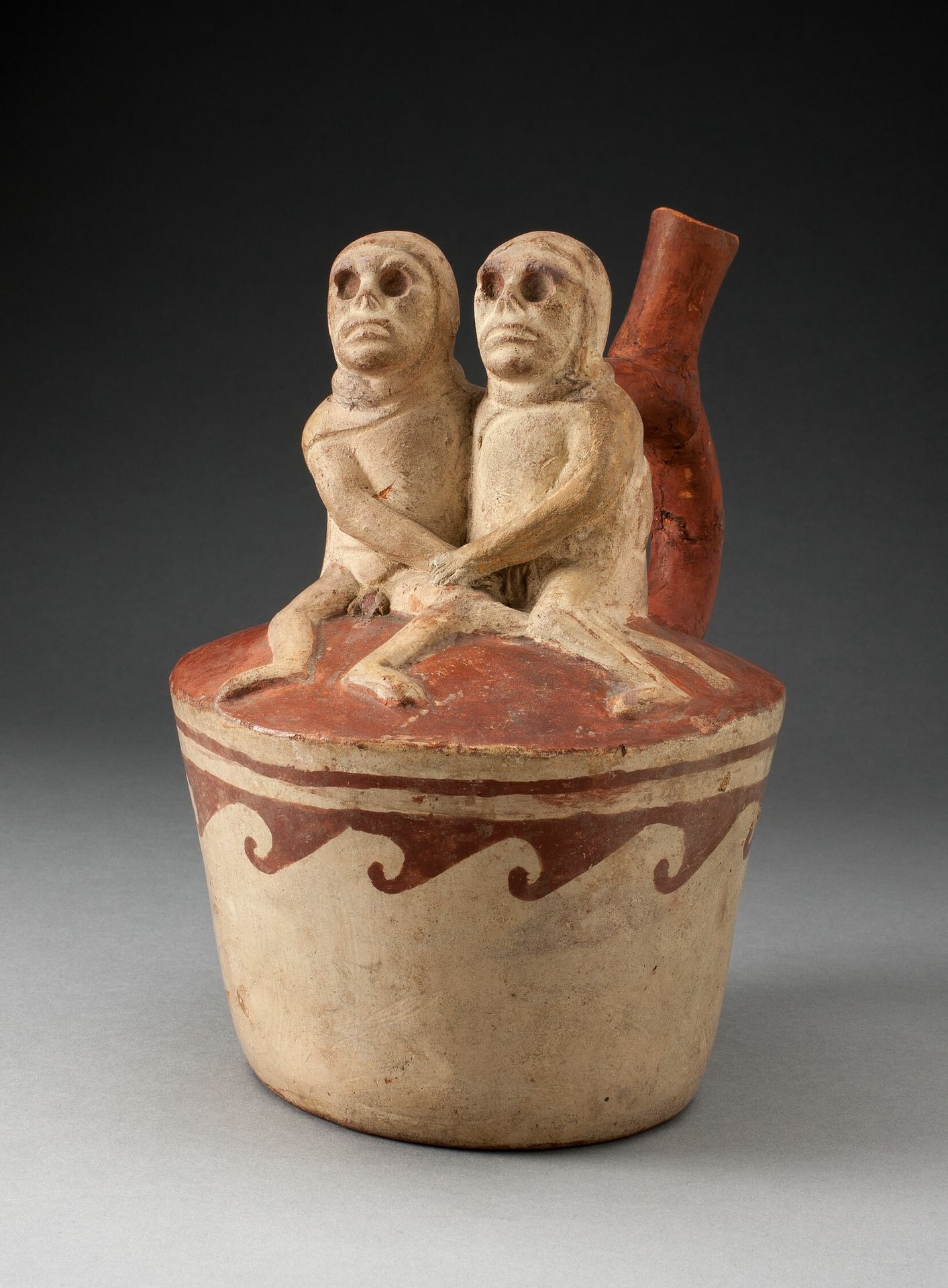 Spout Vessel Depicting Two Skeletal Figures in Erotic Scene Attached to Handle by Moche