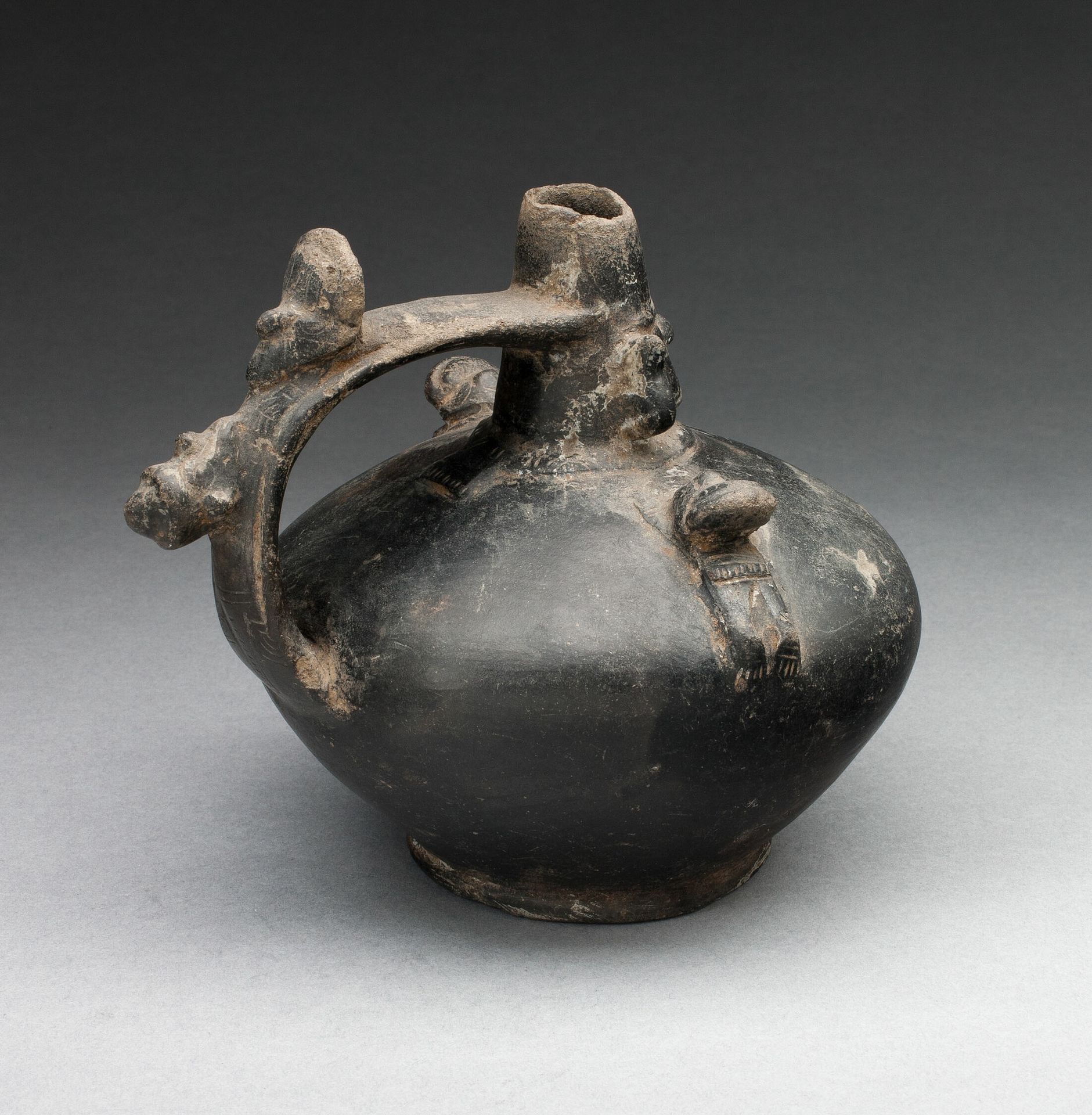 Single Spout Strap Vessel with Attached Molded Figures by Lambayeque