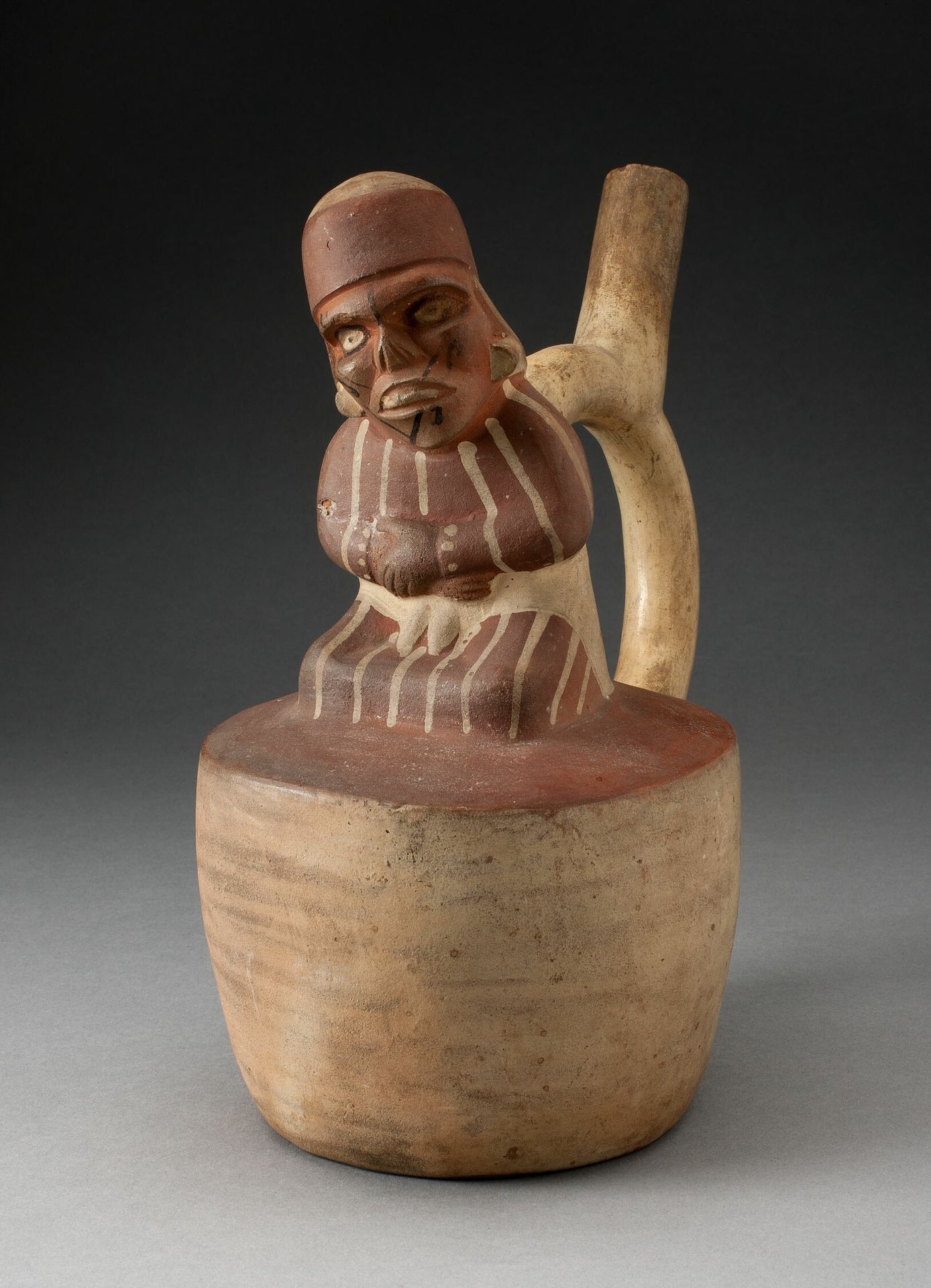 Spout Vessel with Skeletal, Tatooed Figure Attached to Handle by Moche