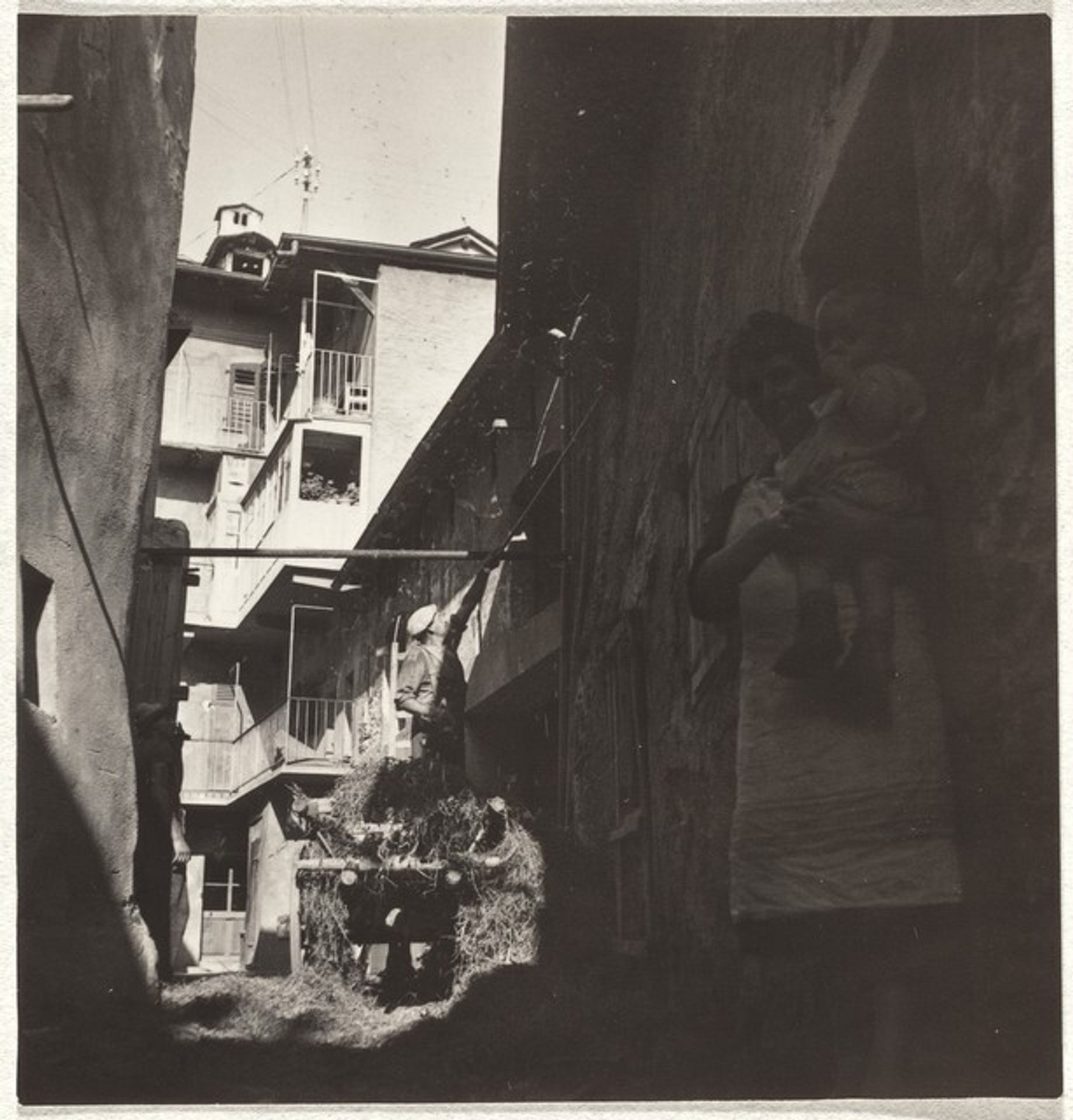 Mother and child in alley--People by Robert Frank