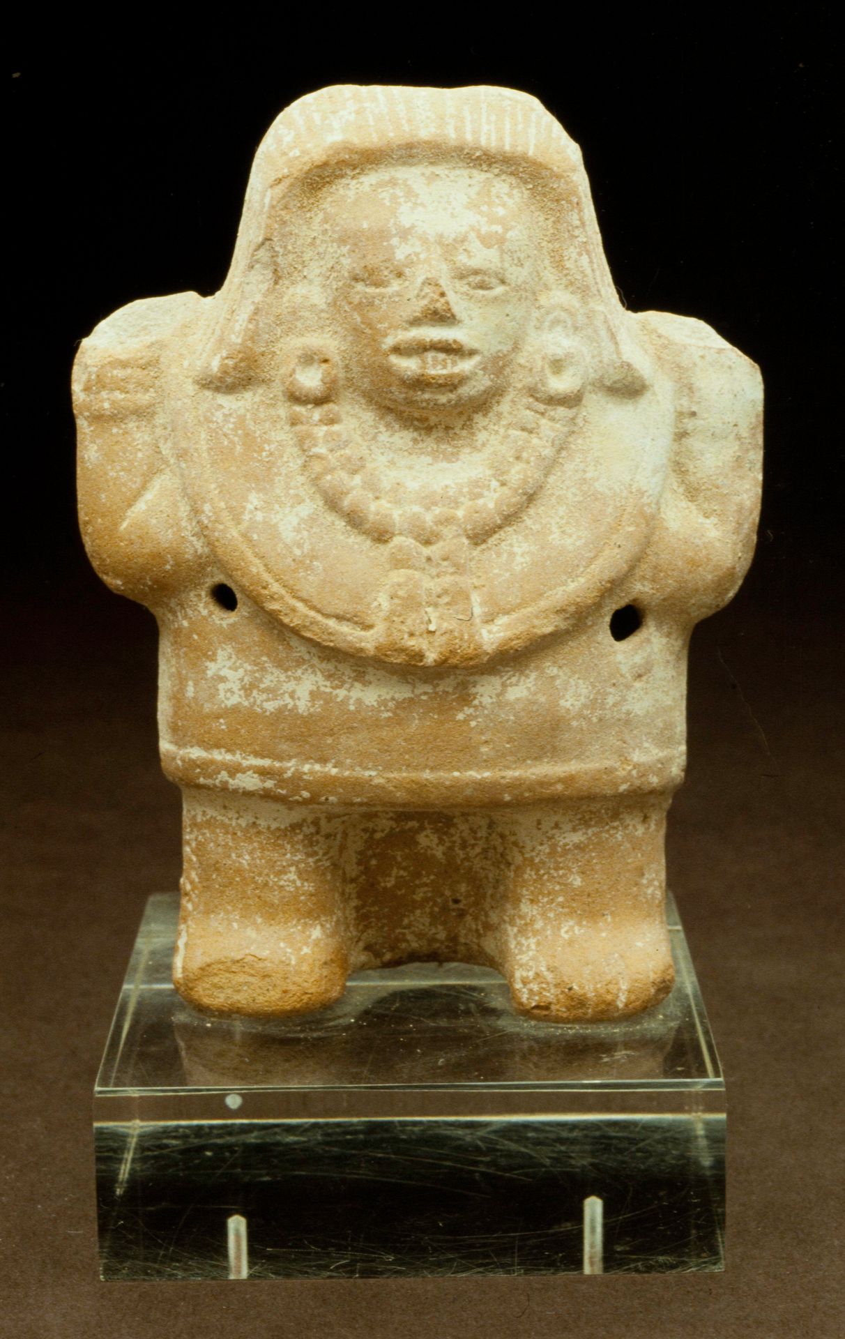 Standing female figure by Maya