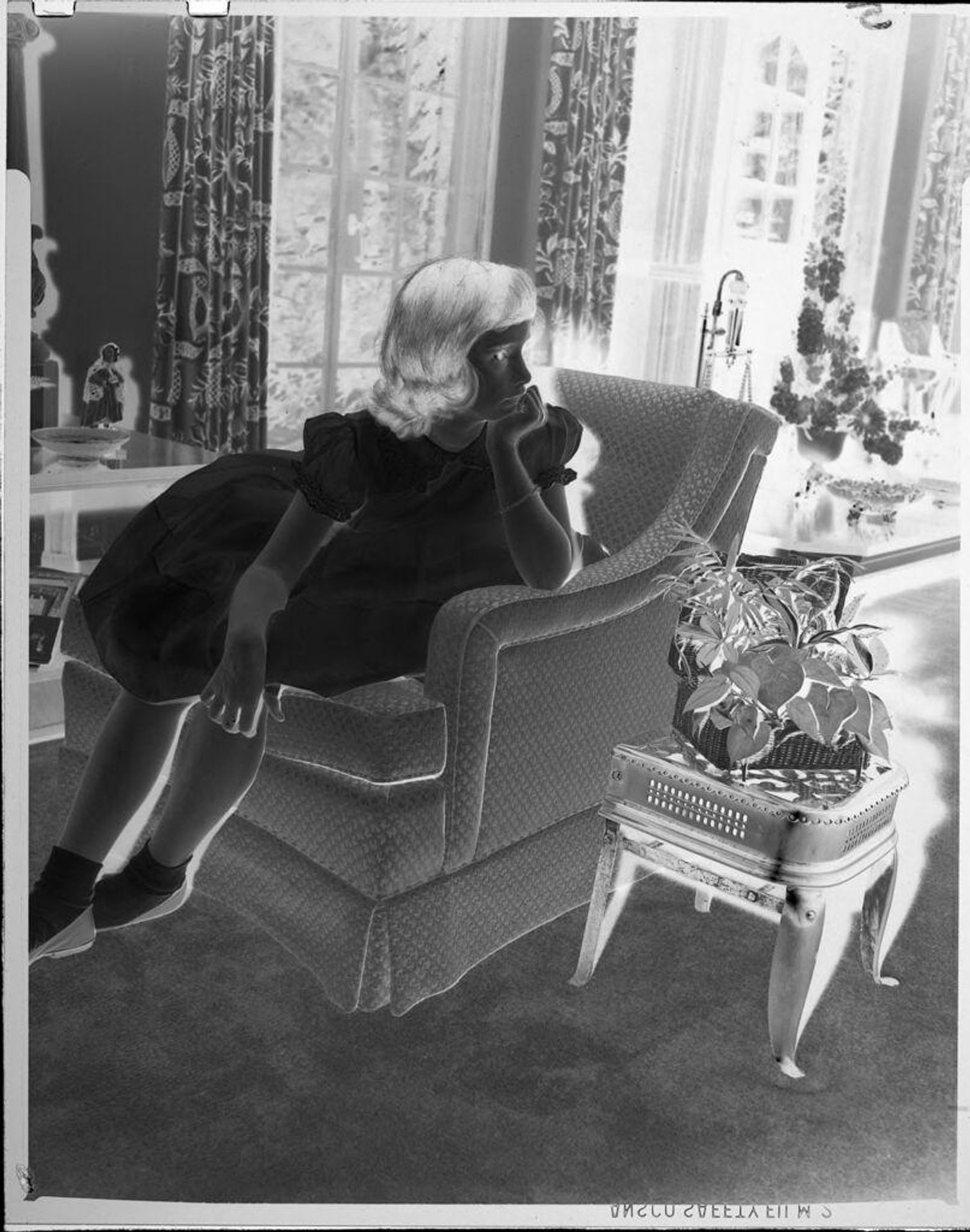 Untitled (little girl sitting on chair) by John Howell