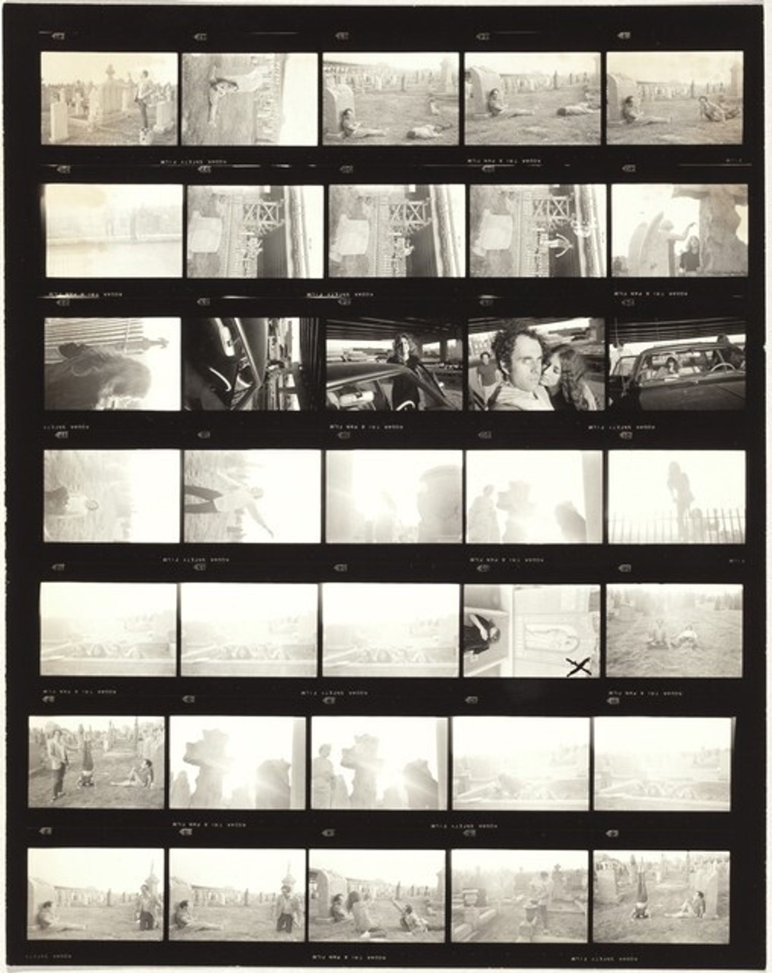 Robert and Mary Frank at cemetery with Ralph Gibson and Sheila no number by Robert Frank