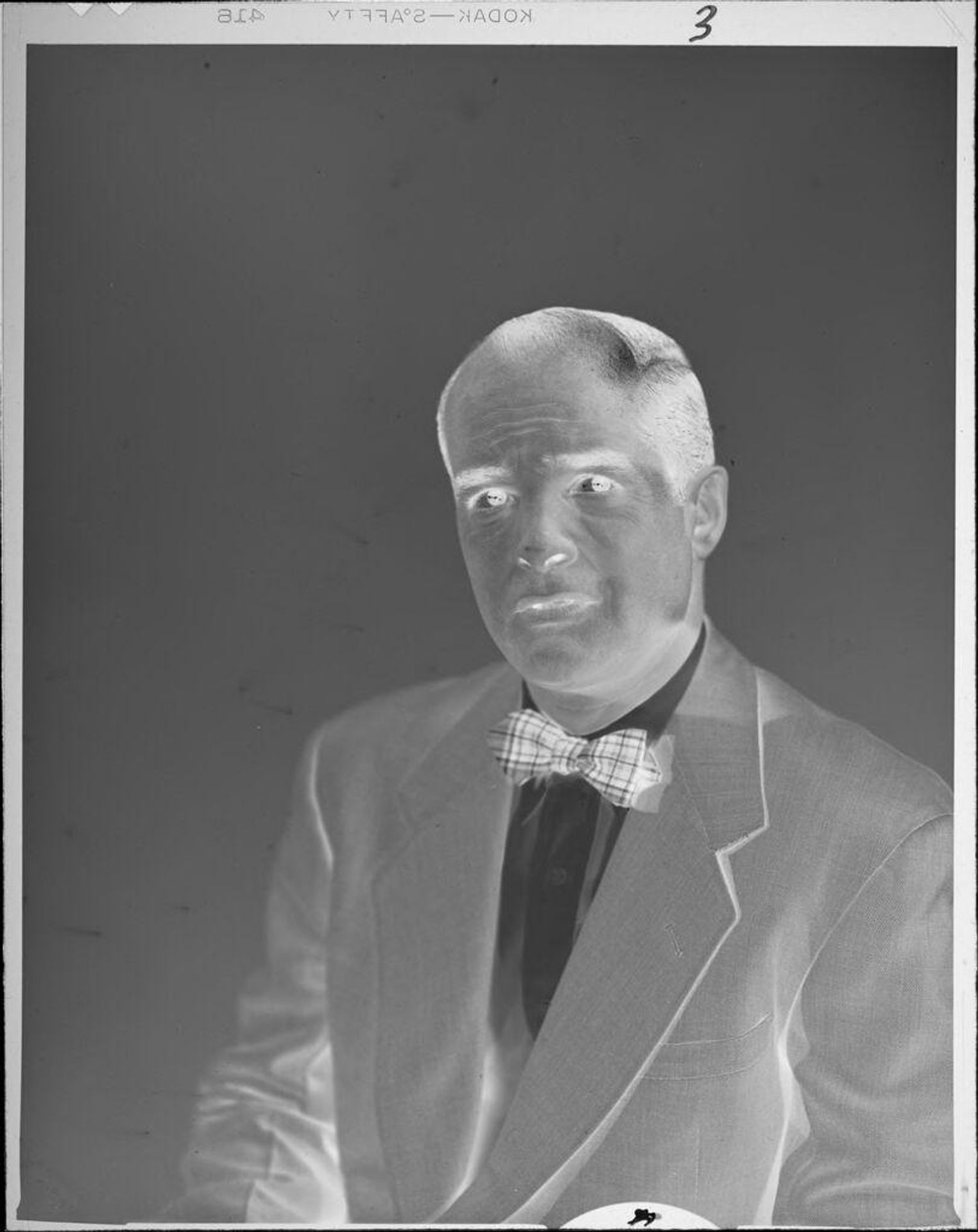 Untitled (portrait of man wearing coat and bowtie) by Lucian and Mary Brown