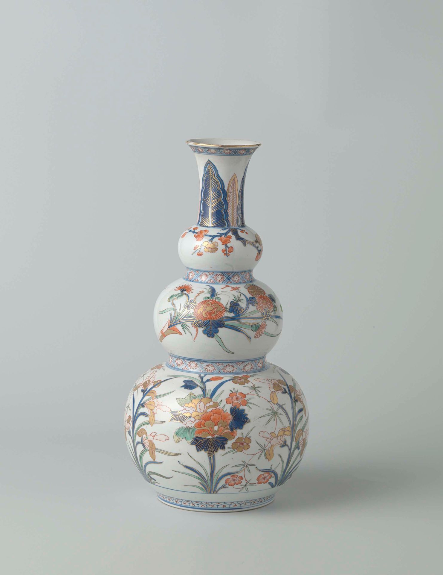 Triple gourd vase painted in Japanese style with large flower sprays by Anonymous