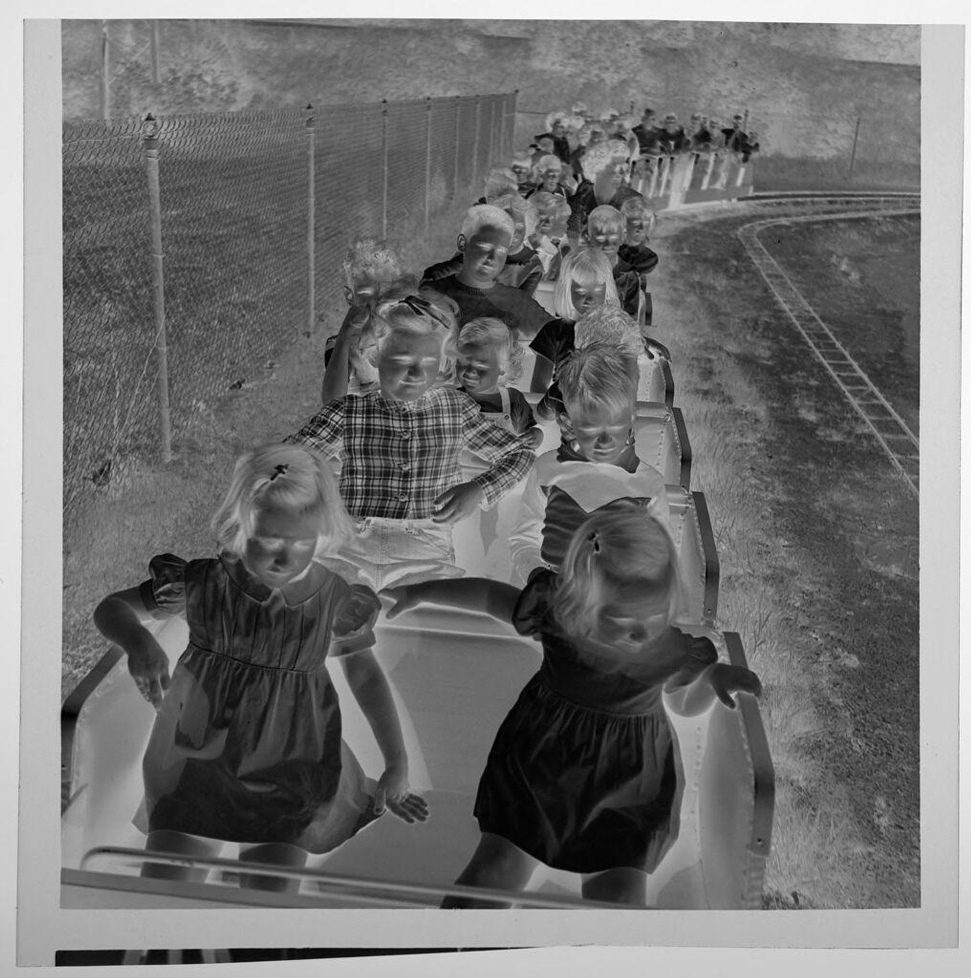 Untitled (boy in cowboy outfit at amusement park) by Jack Gould