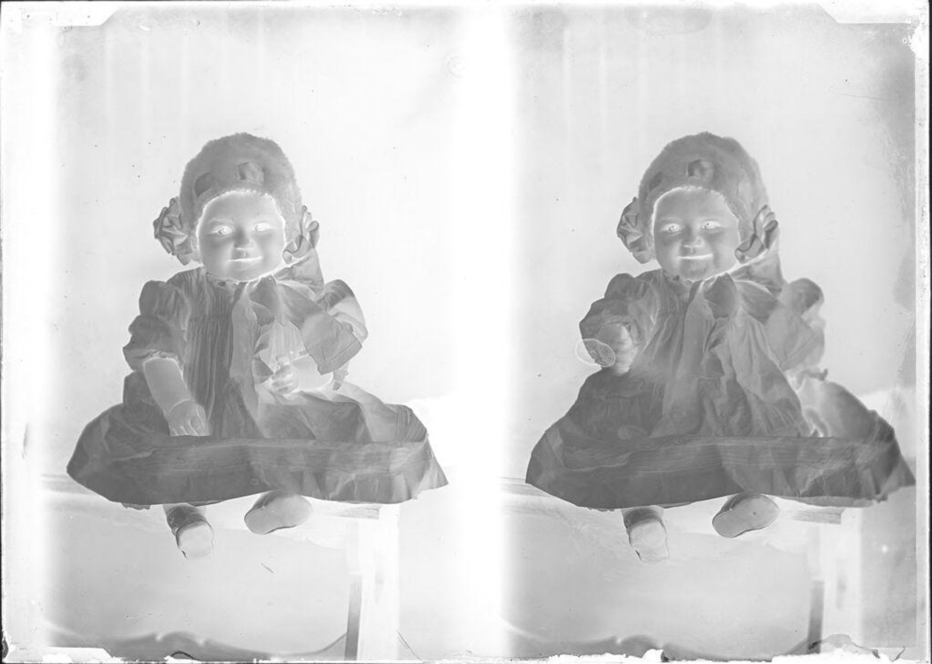 Untitled (two portraits of baby in bonnet) by John Deusing