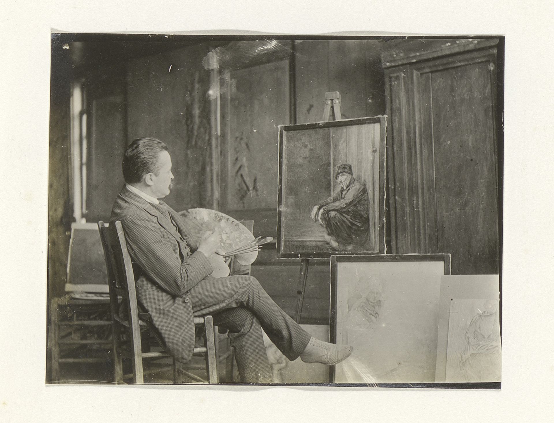 Man in een schildersatelier by G. Hidderley