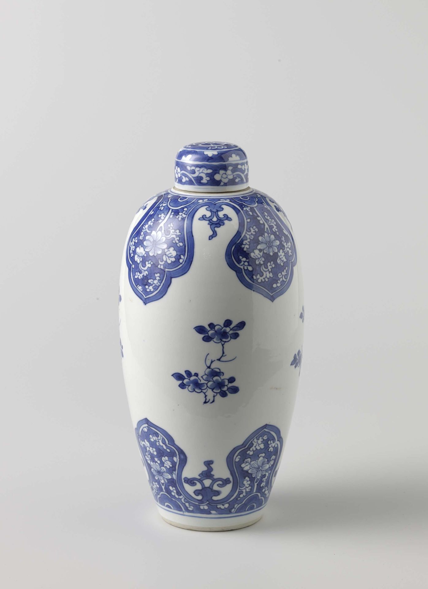 Ovoid covered jar with flower scrolls in lappet borders by Anonymous