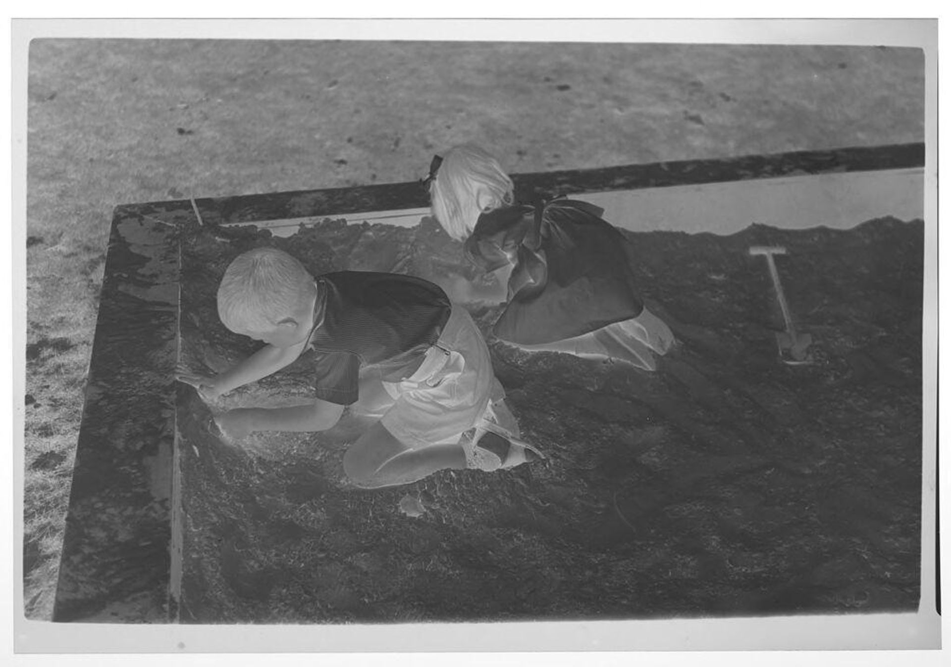 Untitled (boy and girl in sandbox) by Lucian and Mary Brown