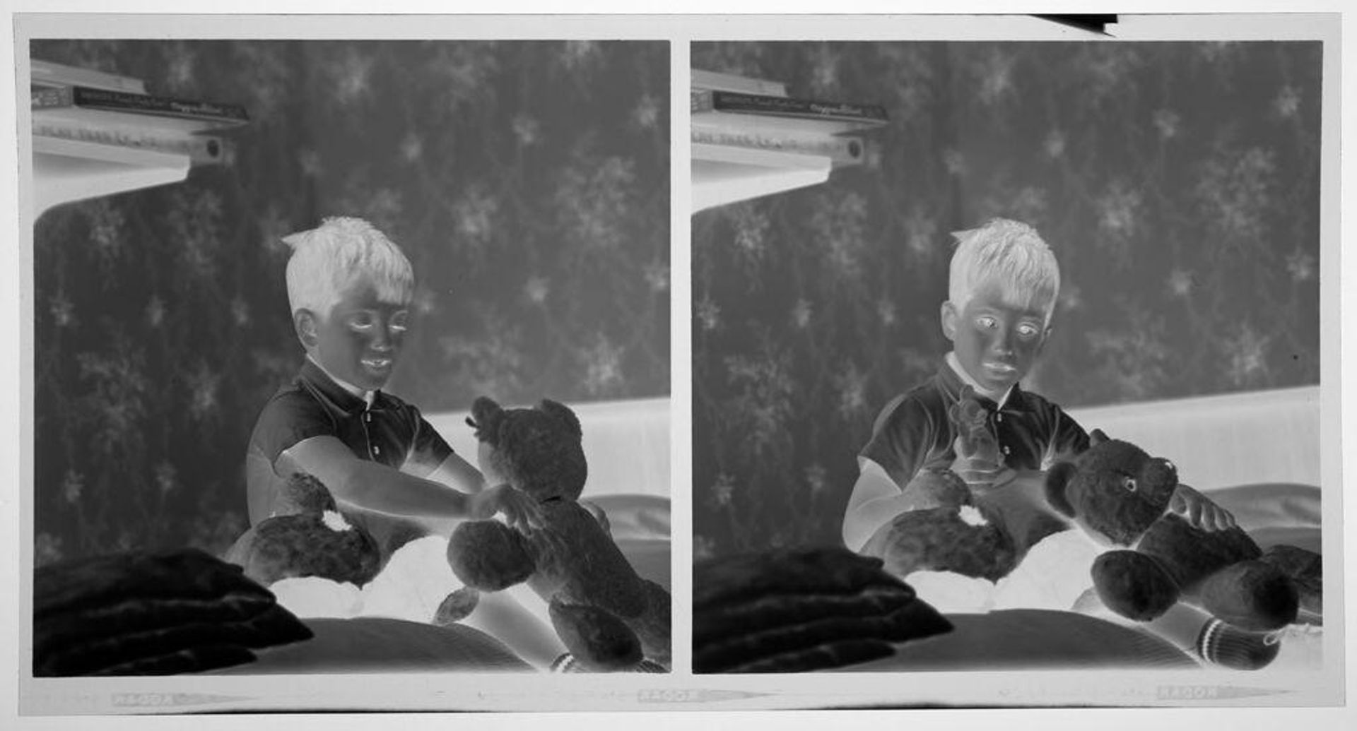 Untitled (medium format images of young boy posed sitting on bed with stuffed animals) by Martin Schweig