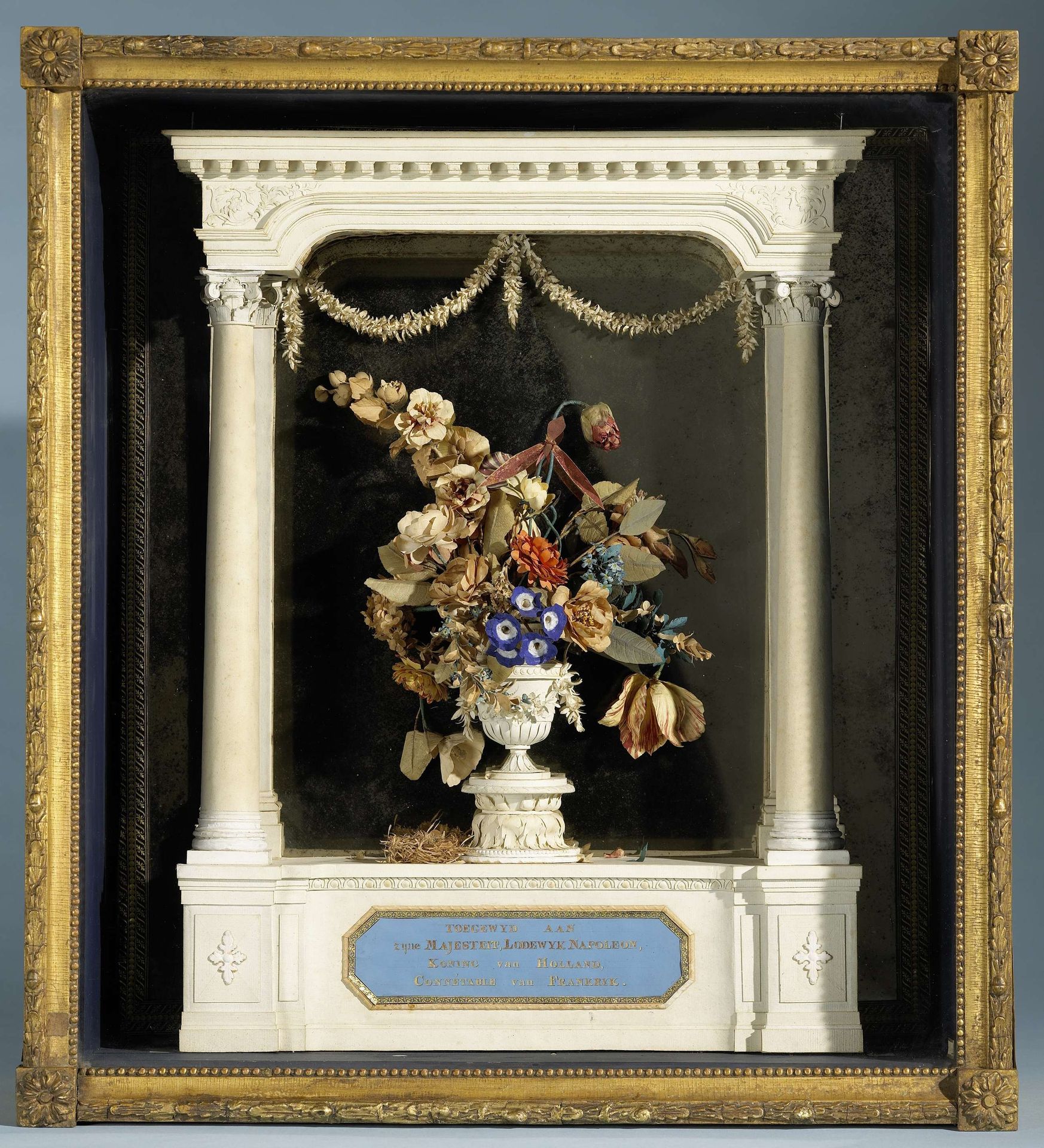 Bloemvaas onder portiek gewijd aan Lodewijk Napoleon by C. Schoon