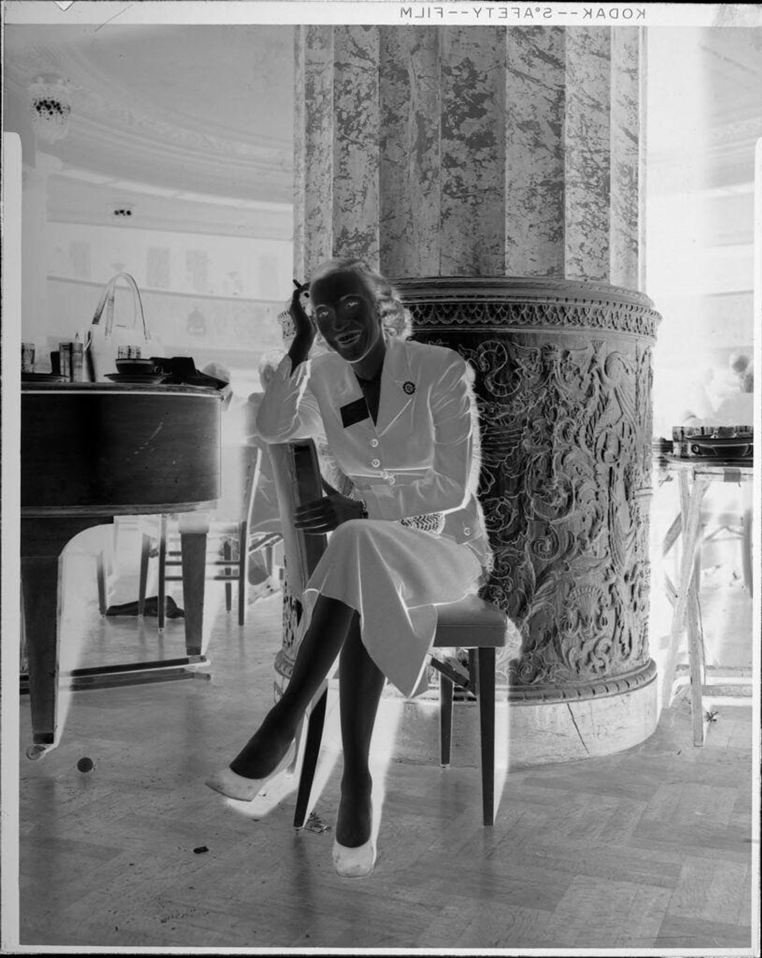 Untitled (woman in chair) by Peter James Studio