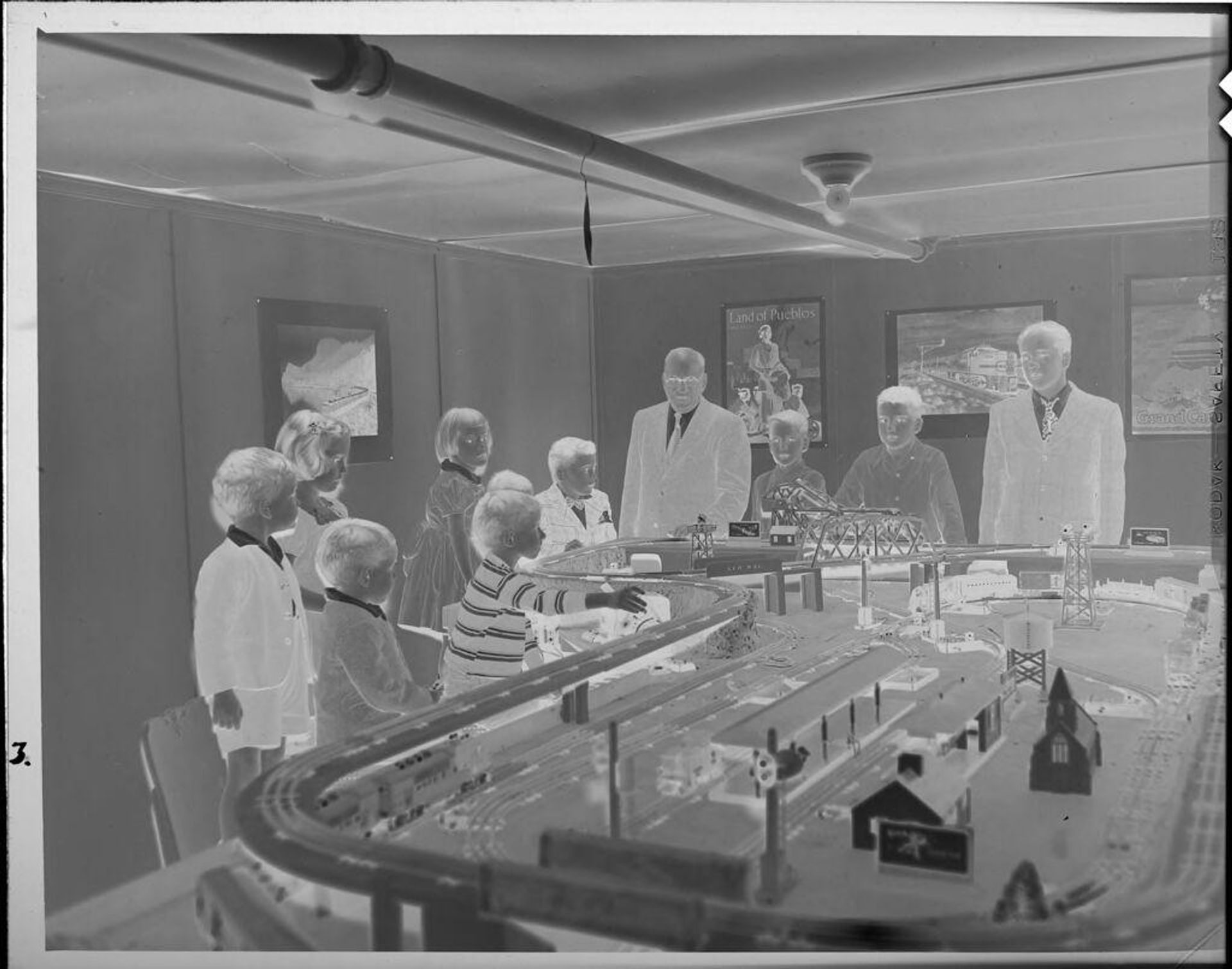 Untitled (man and children with large model train) by Lucian and Mary Brown