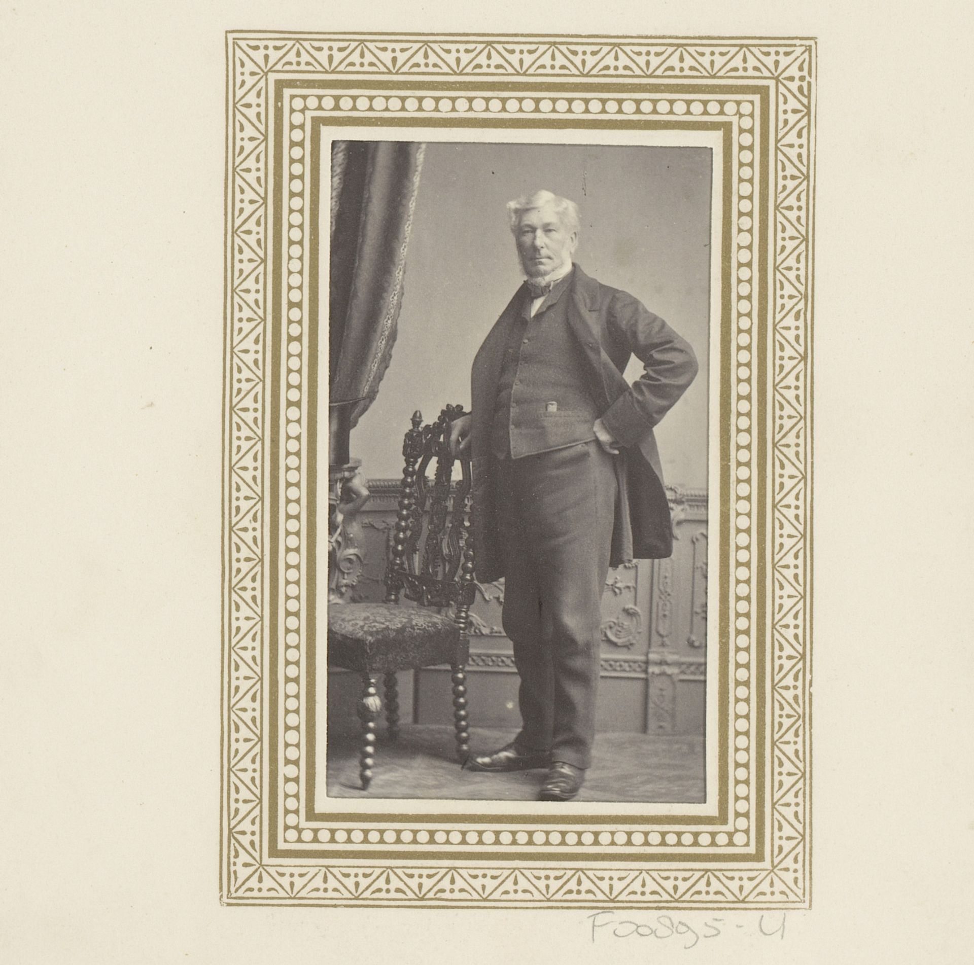 Portret van een man, staand bij een tafel by Charles Thomas Newcombe