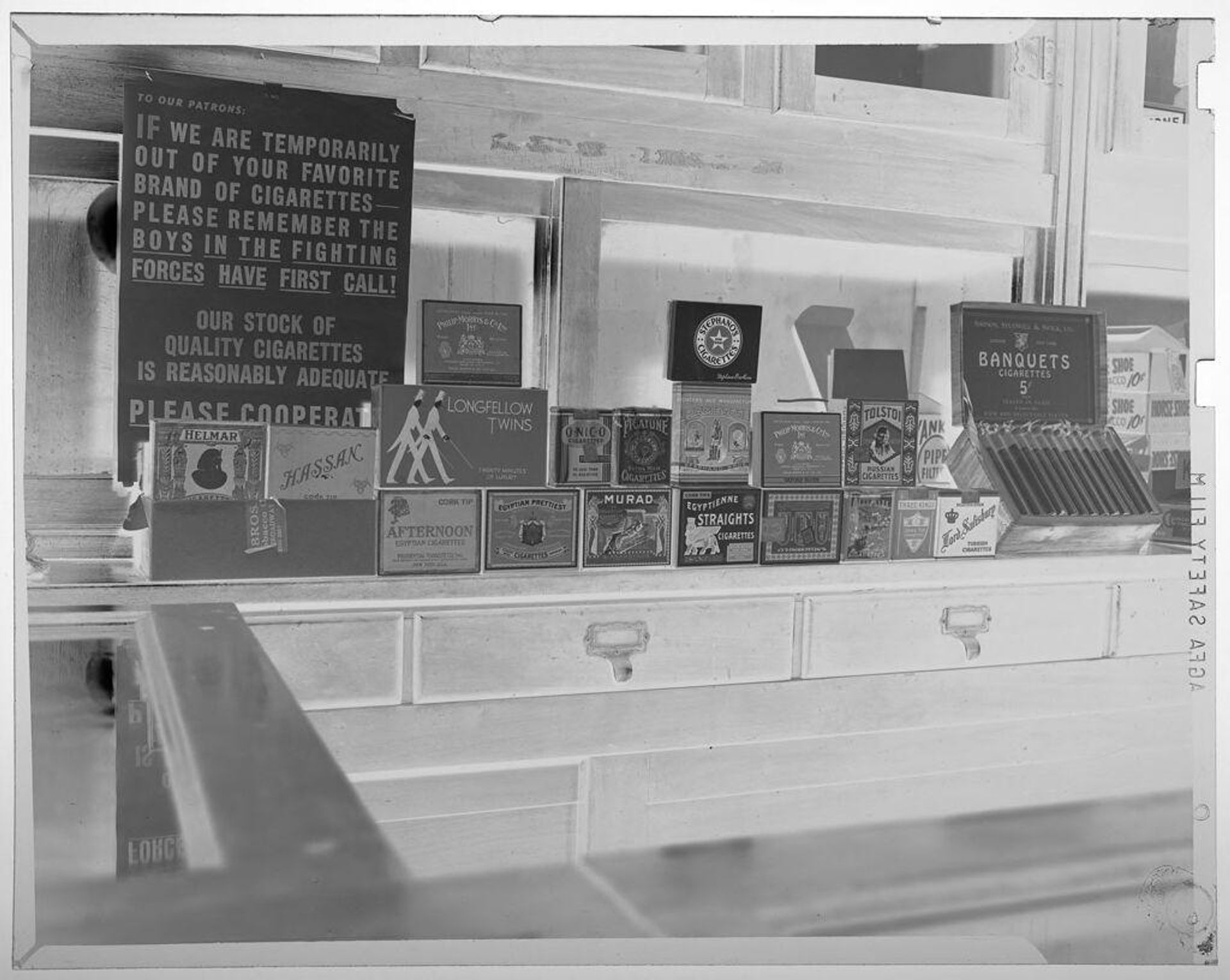 Untitled (display of cigarette boxes inside store) by Jack Gould
