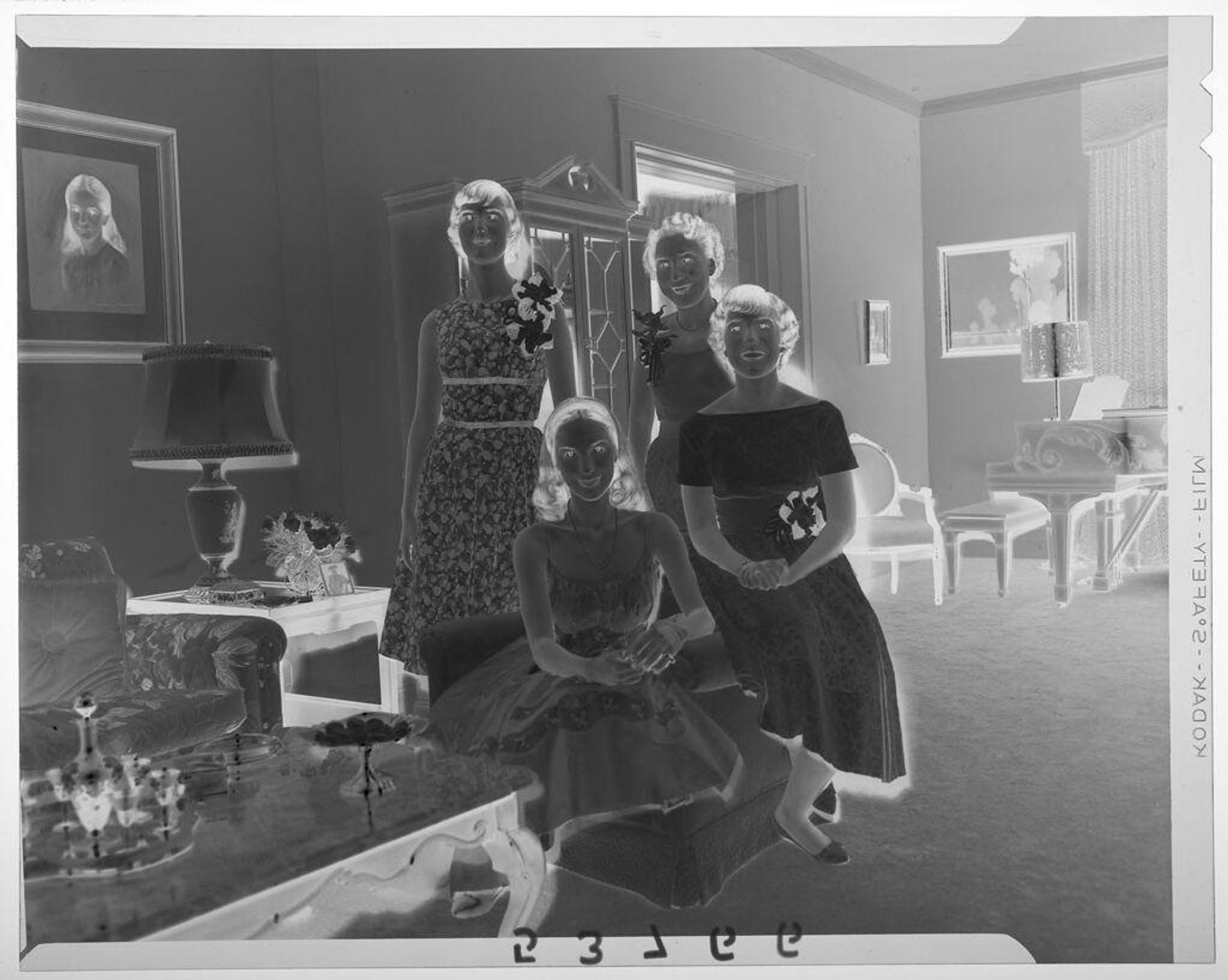 Untitled (woman posing with three daughters in fancy living room) by Martin Schweig