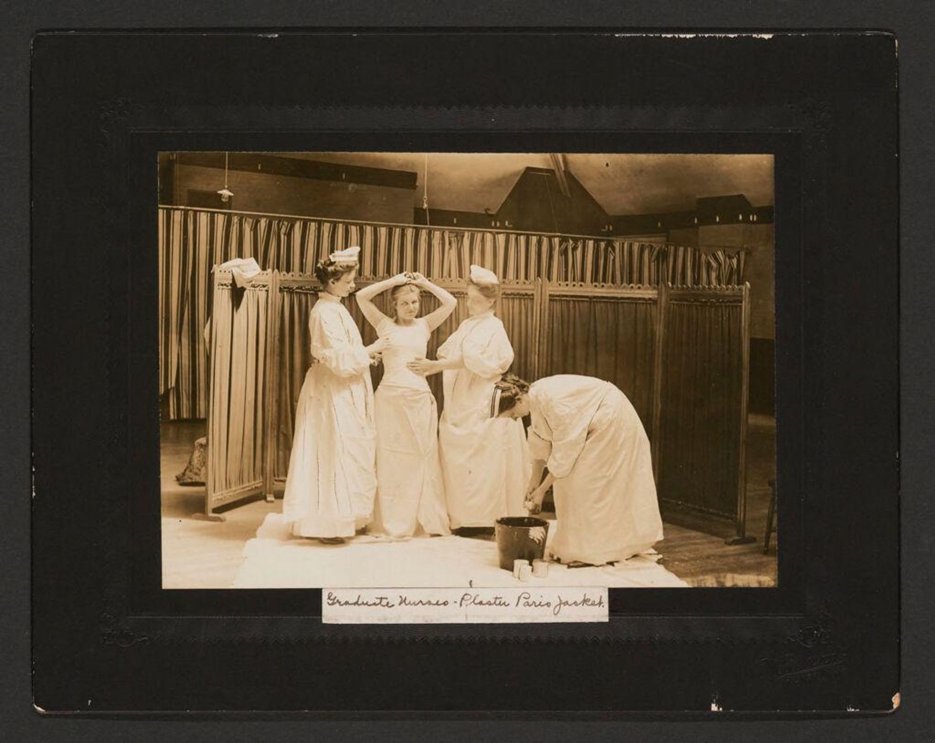 Defectives, Epileptics: United States. Massachusetts. Palmer. State Hospital for Epileptics: Graduate Nurses - Plaster Paris Jacket. by Woodhead Studio