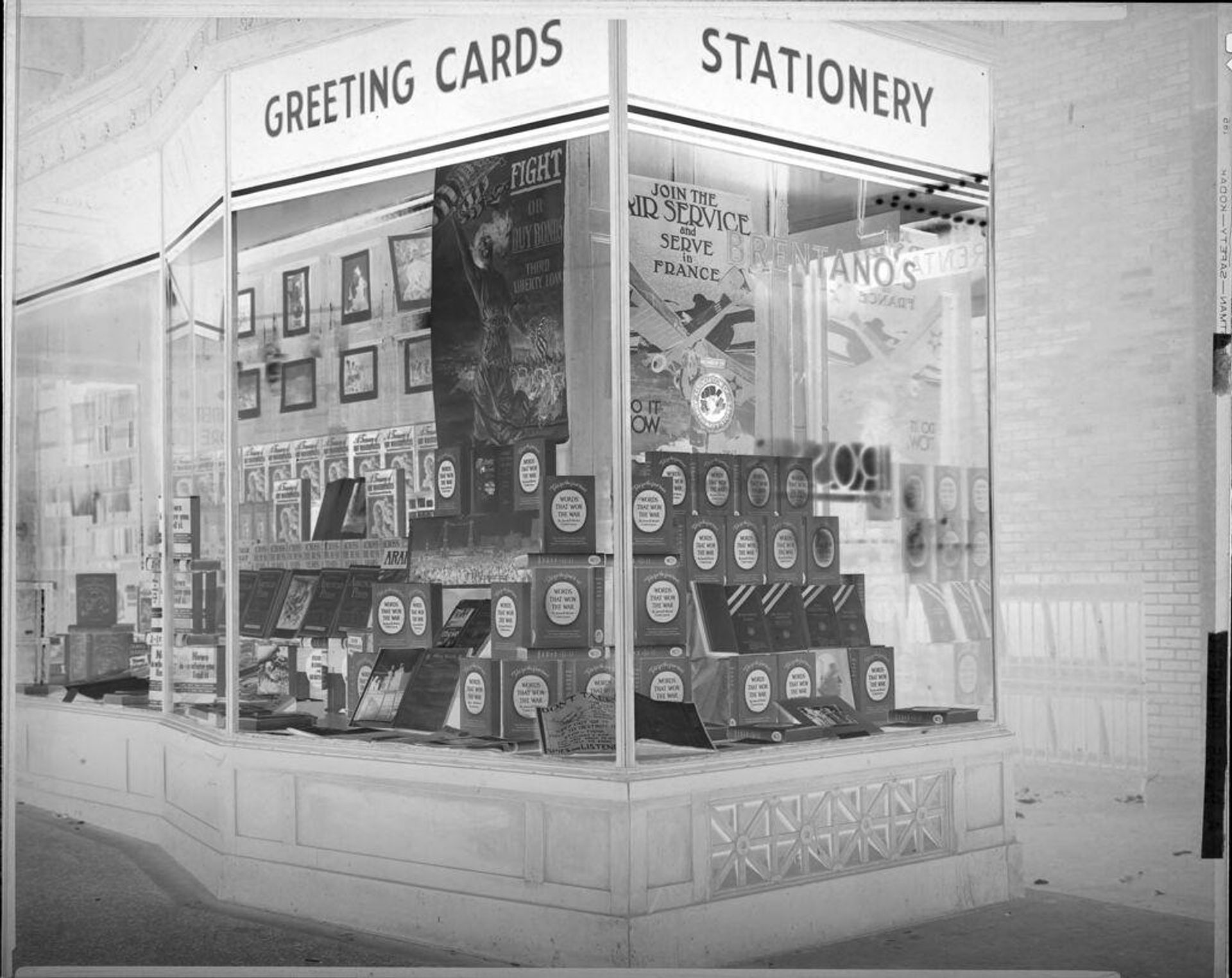 Untitled (store front, Brentanoâs, recruitment posters, Words That Won the War book display) by Harris & Ewing