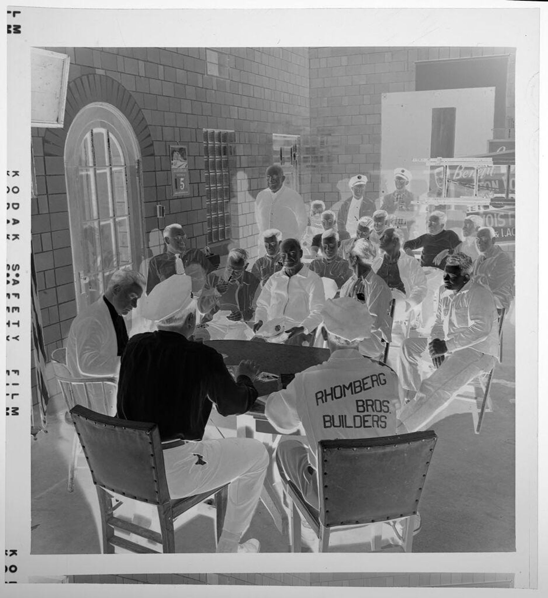 Untitled (large group of firemen seated around table) by Jack Gould