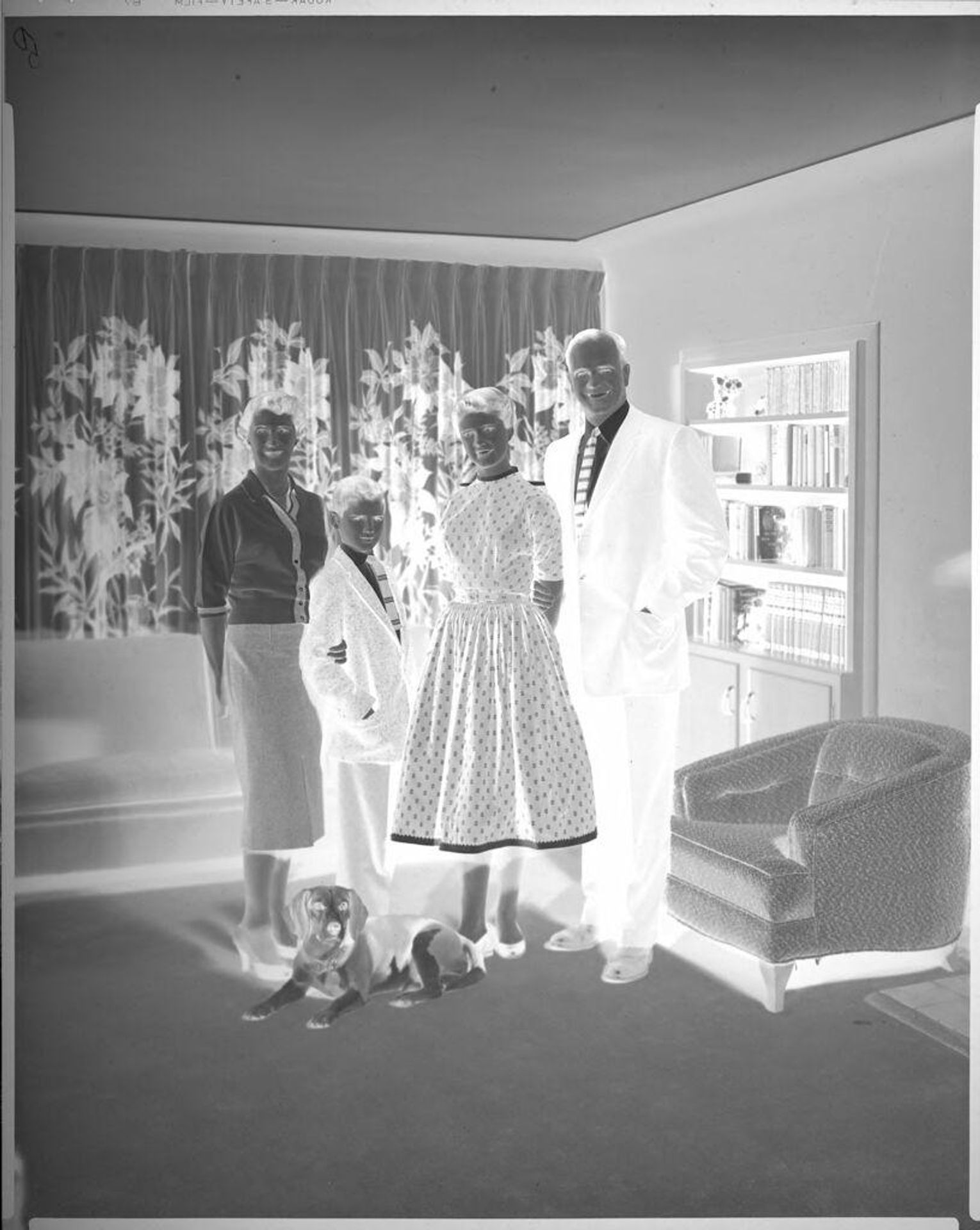 Untitled (family portrait in living room) by Lainson Studios