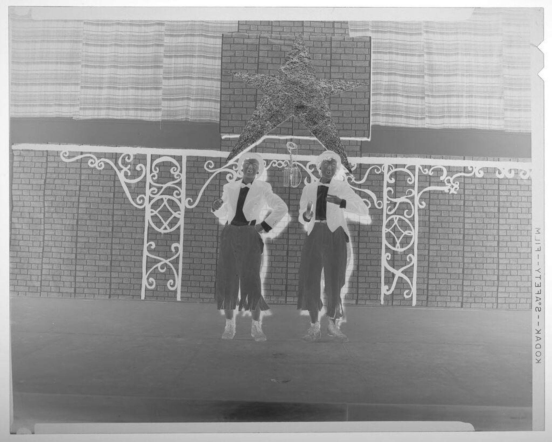 Untitled (two women in costumes and bowties performing on stage) by Martin Schweig