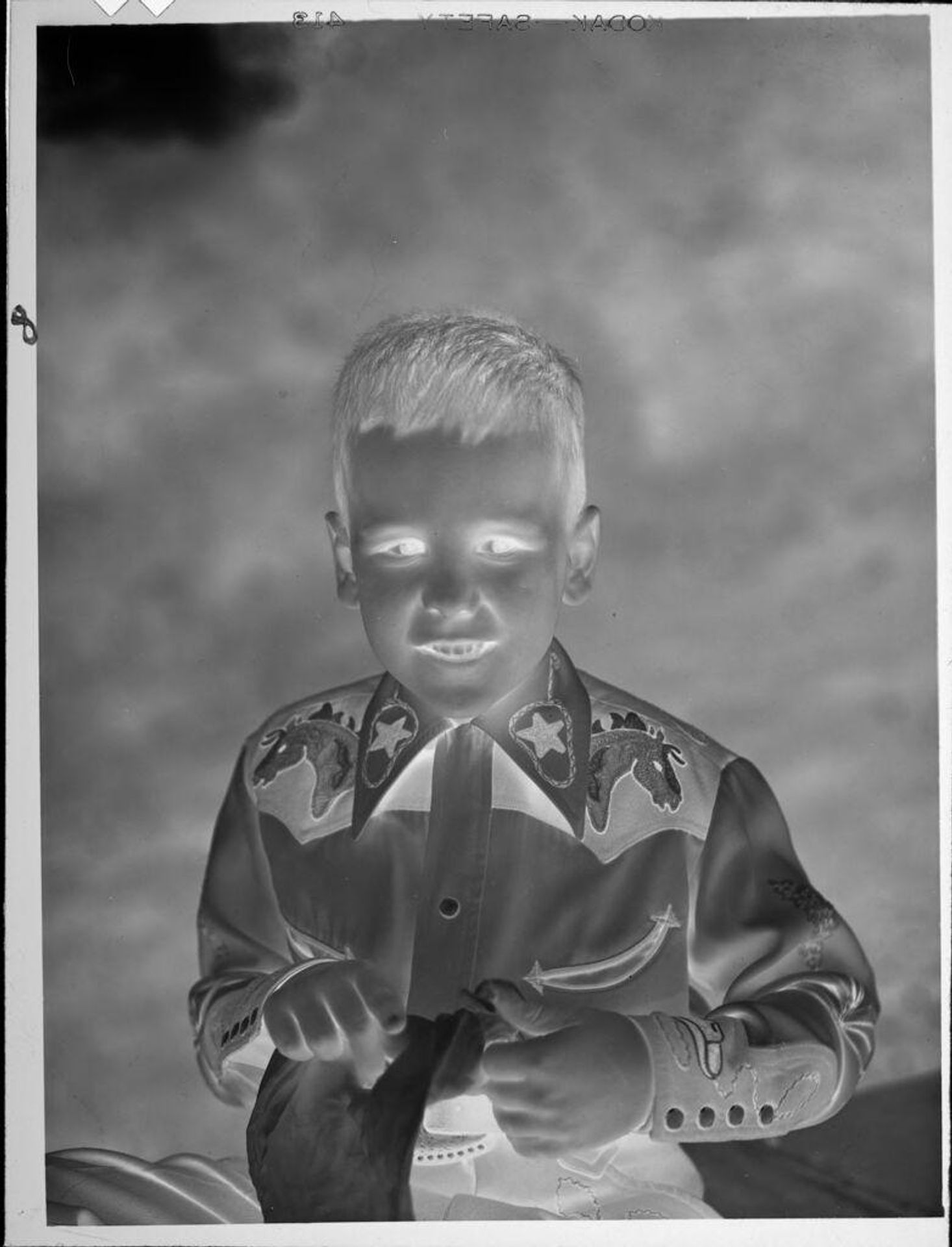 Untitled (boy in cowboy shirt) by Lucian and Mary Brown