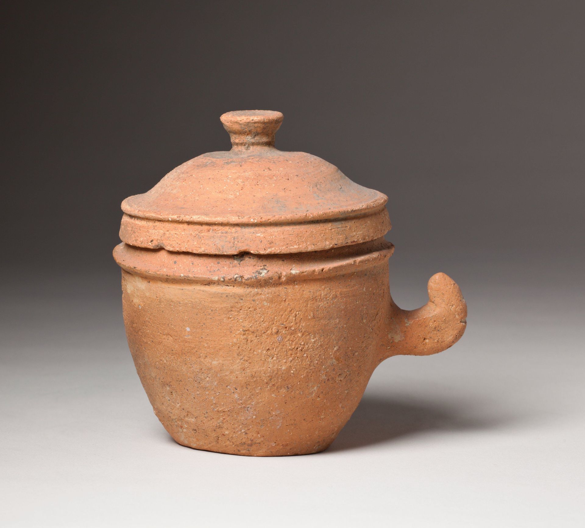 Small lidded jar with handle by Anonymous