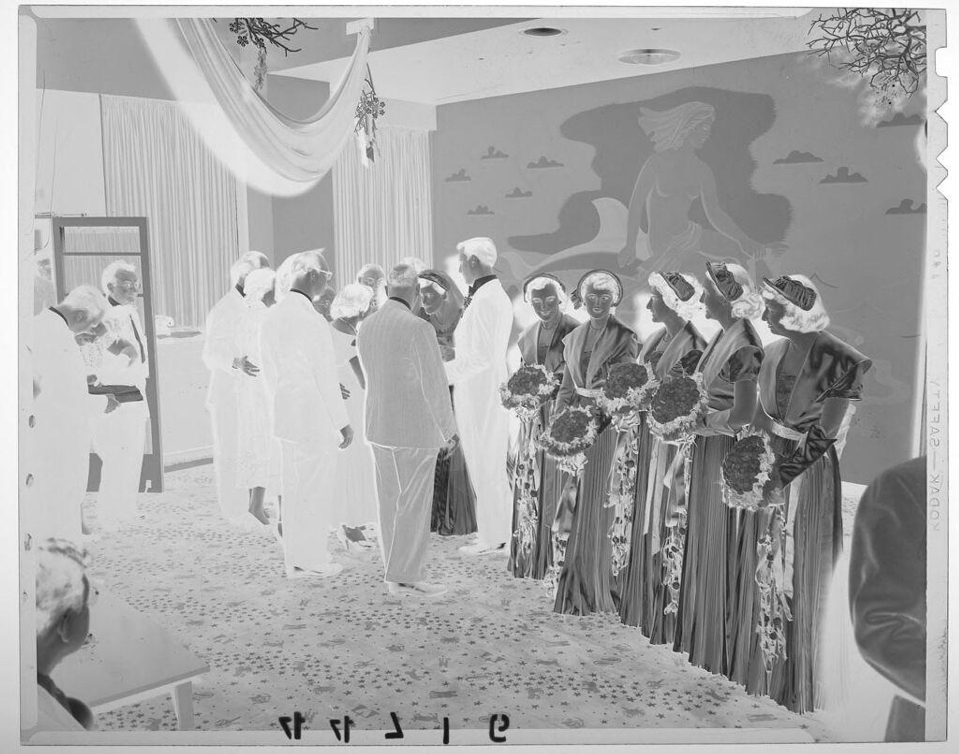 Untitled (wedding receiving line with women and men gathered around bride) by Martin Schweig