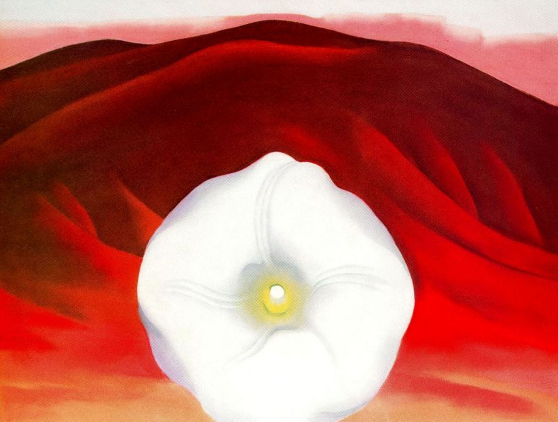 Red hills and white flower by Georgia O'Keeffe