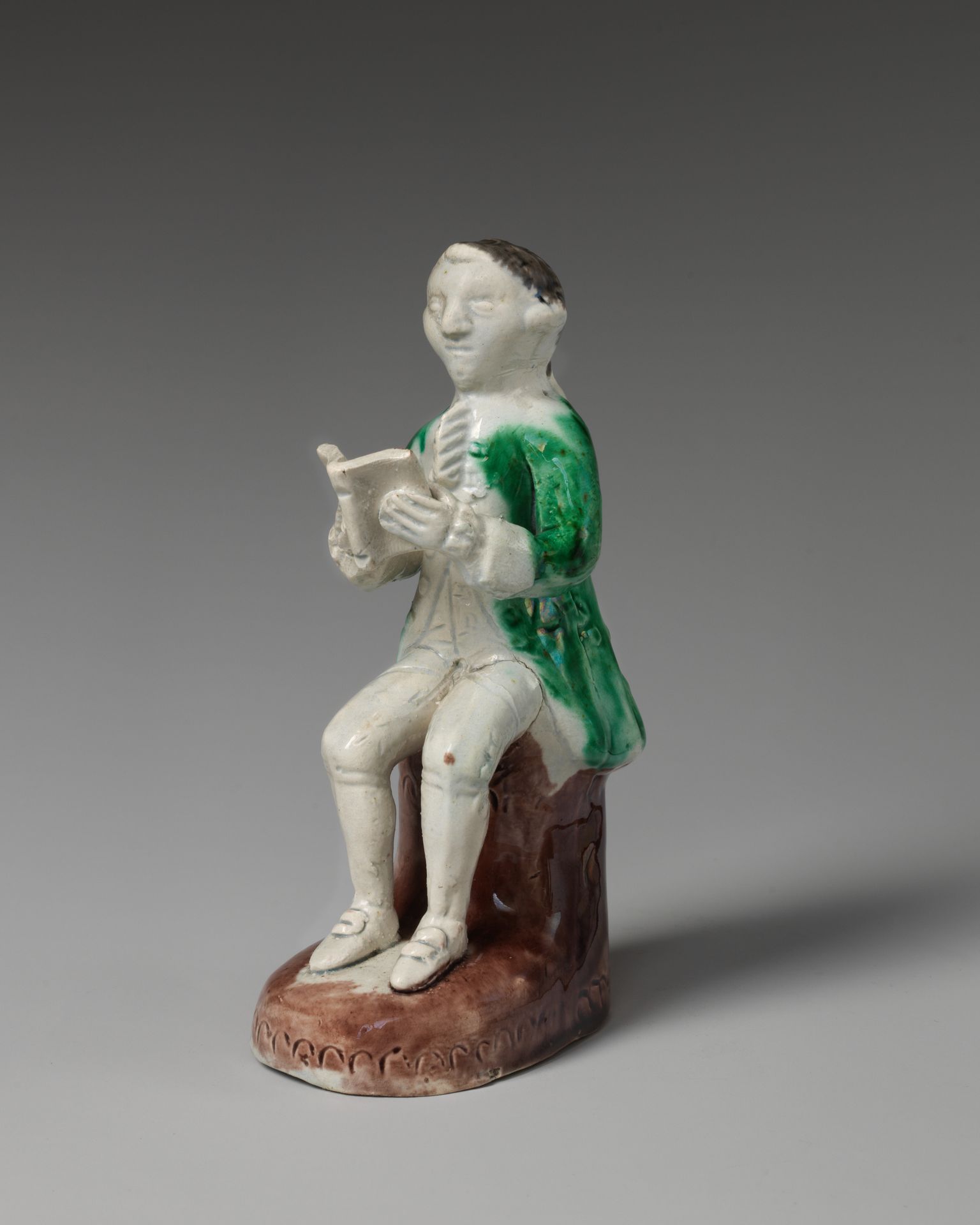 Figure of a man reading by Whieldon type