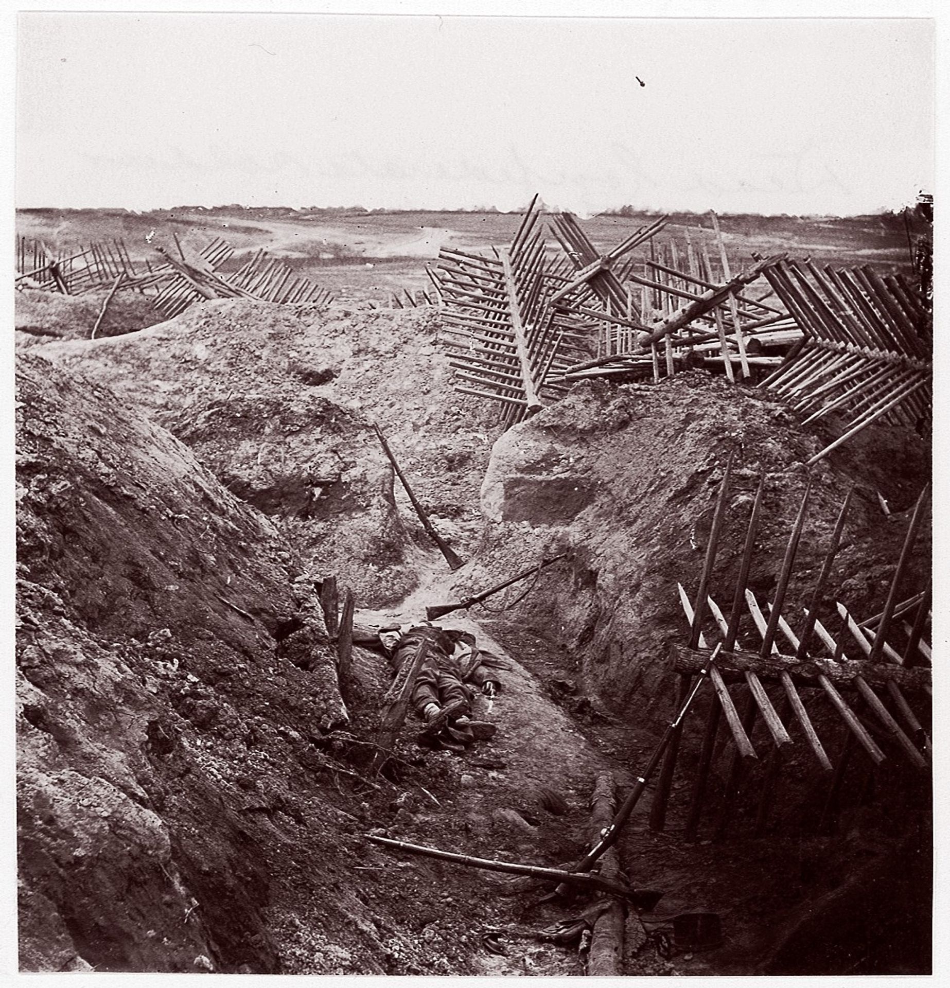 [Dead Confederate Soldier in the Trenches of Fort Mahone, Petersburg, Virginia] by Thomas C. Roche