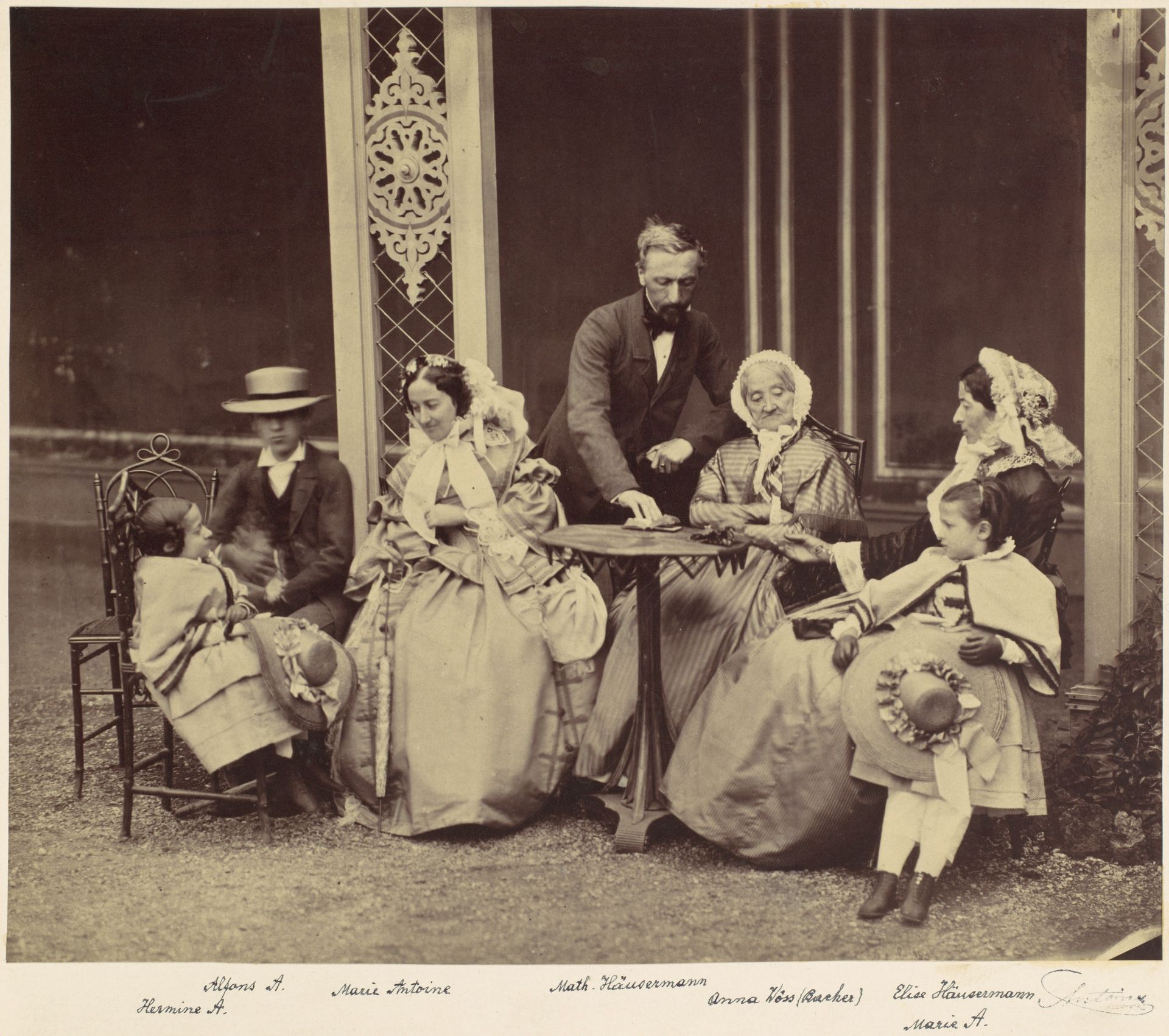 [Group Portrait of Five Adults and Two Children in a Garden] by Franz Antoine