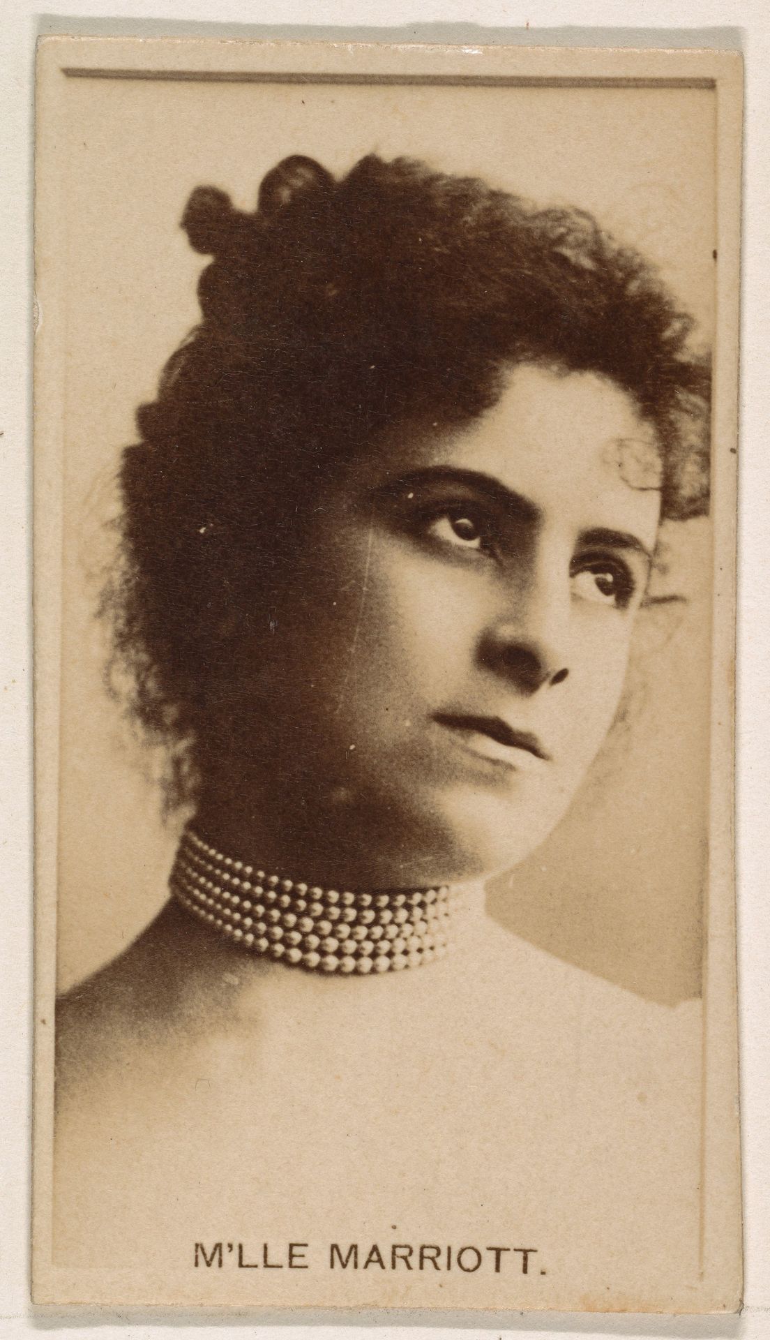 M'lle Marriott, from the Actresses series (N245) issued by Kinney Brothers to promote Sweet Caporal Cigarettes by Kinney Brothers Tobacco Company