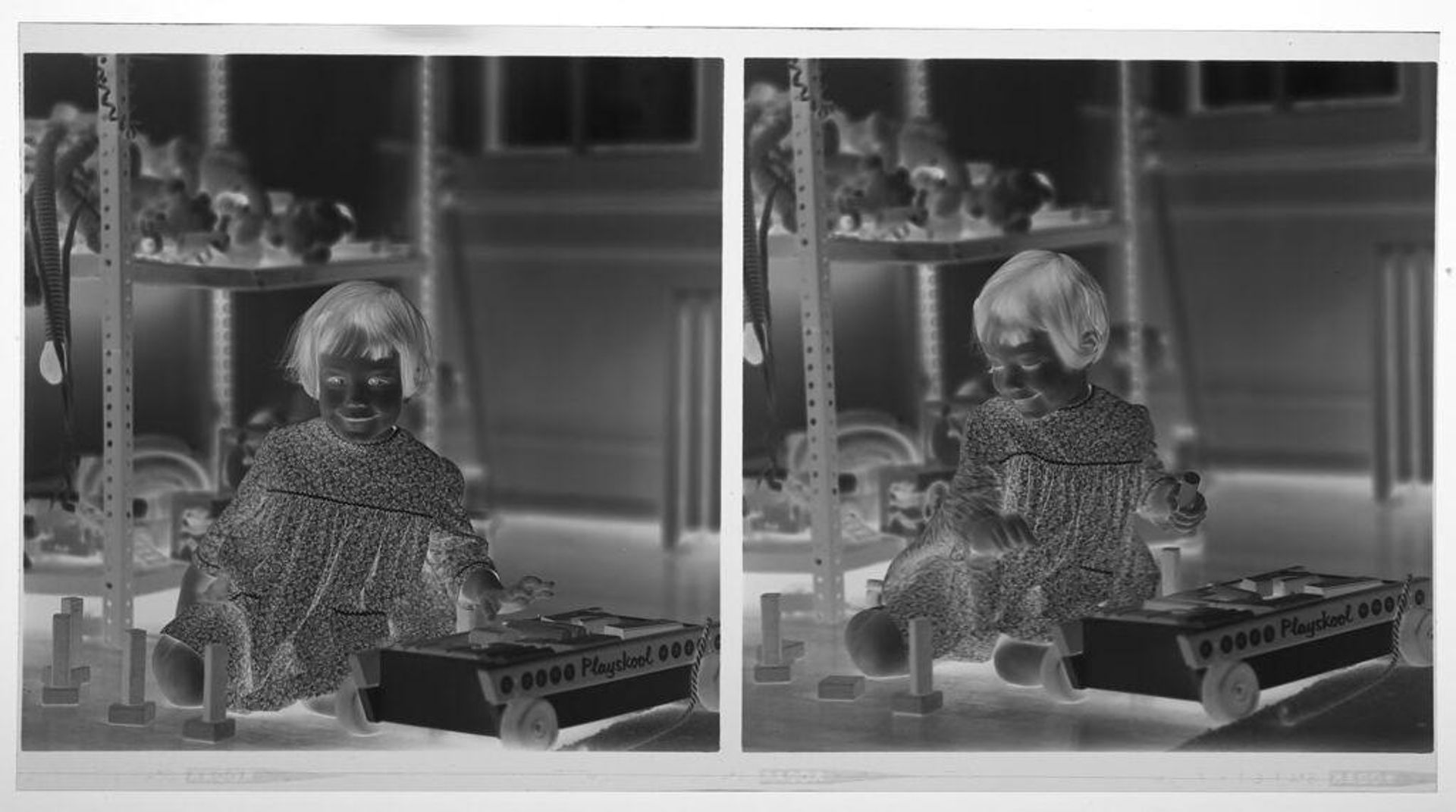 Untitled (medium format images of girl playing with toys on floor) by Martin Schweig
