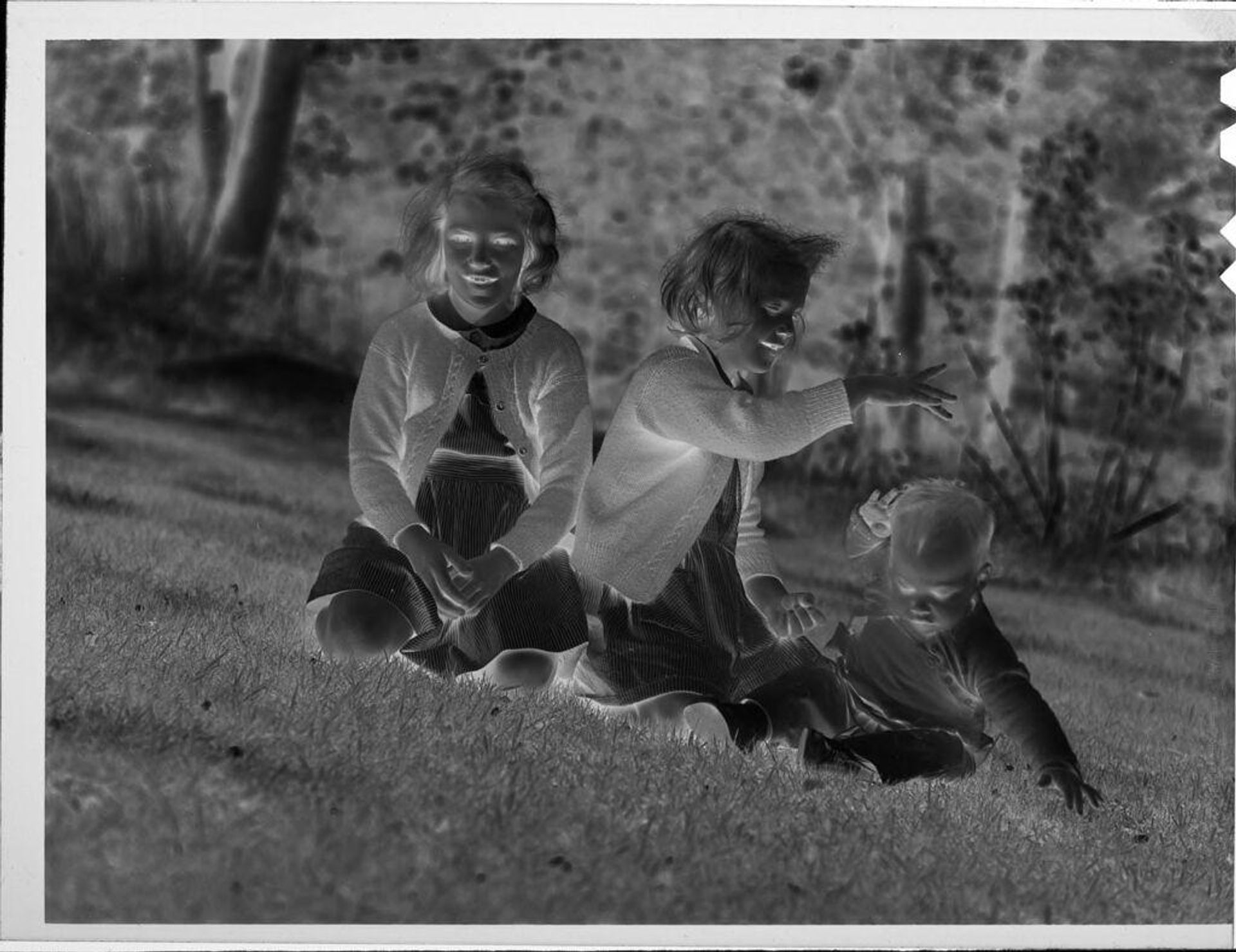 Untitled (two girls and baby outside) by Lucian and Mary Brown