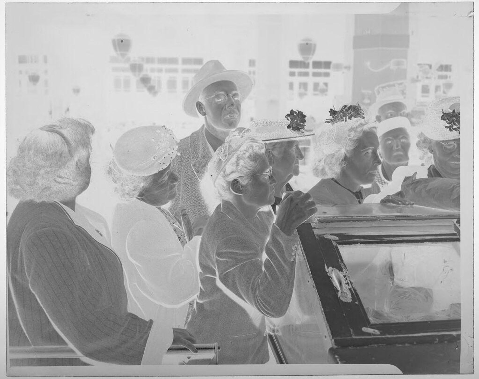 Untitled (several people lined up to purchase meat at counter) by Jack Gould