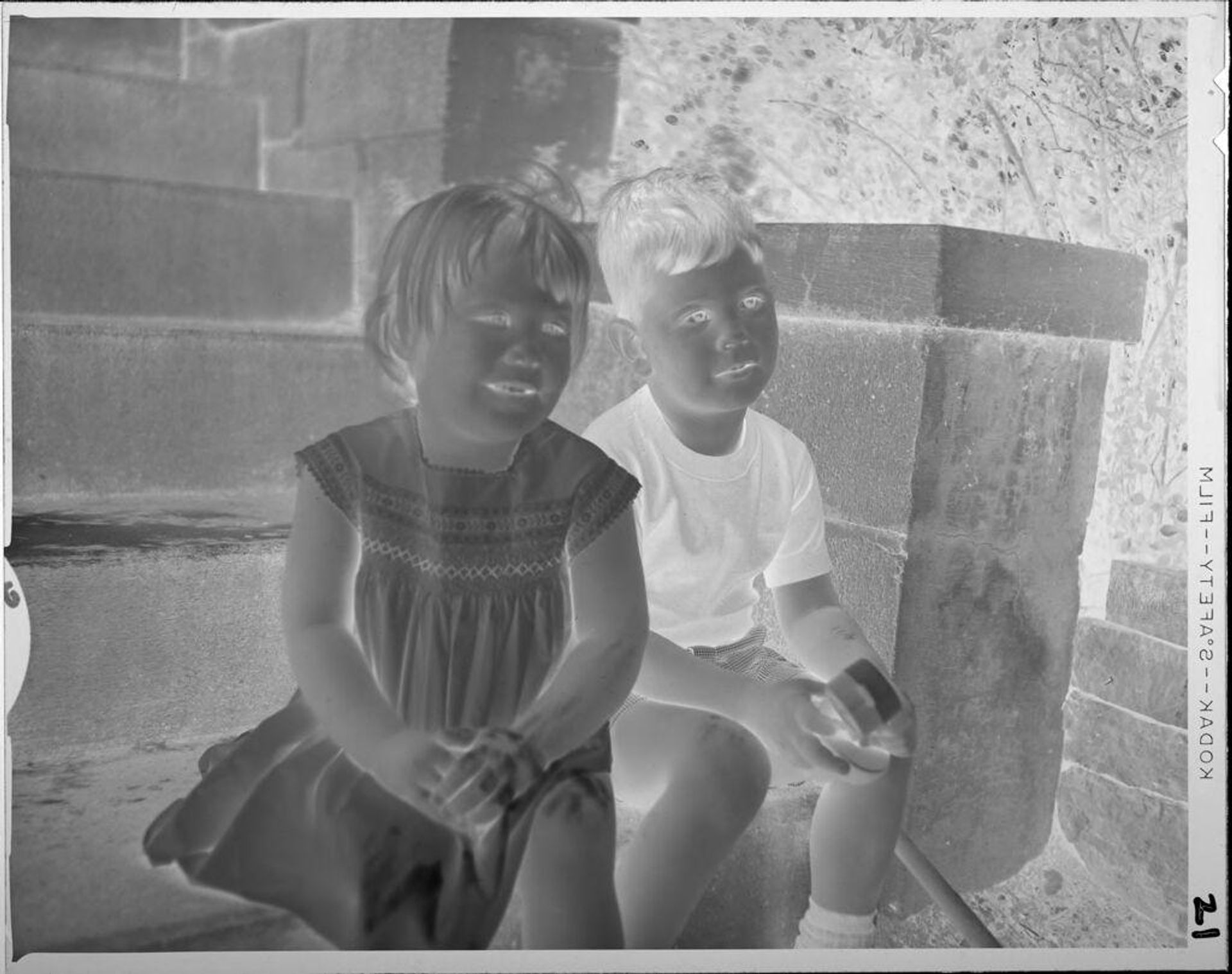 Untitled (boy and girl sitting on stairs) by Lucian and Mary Brown