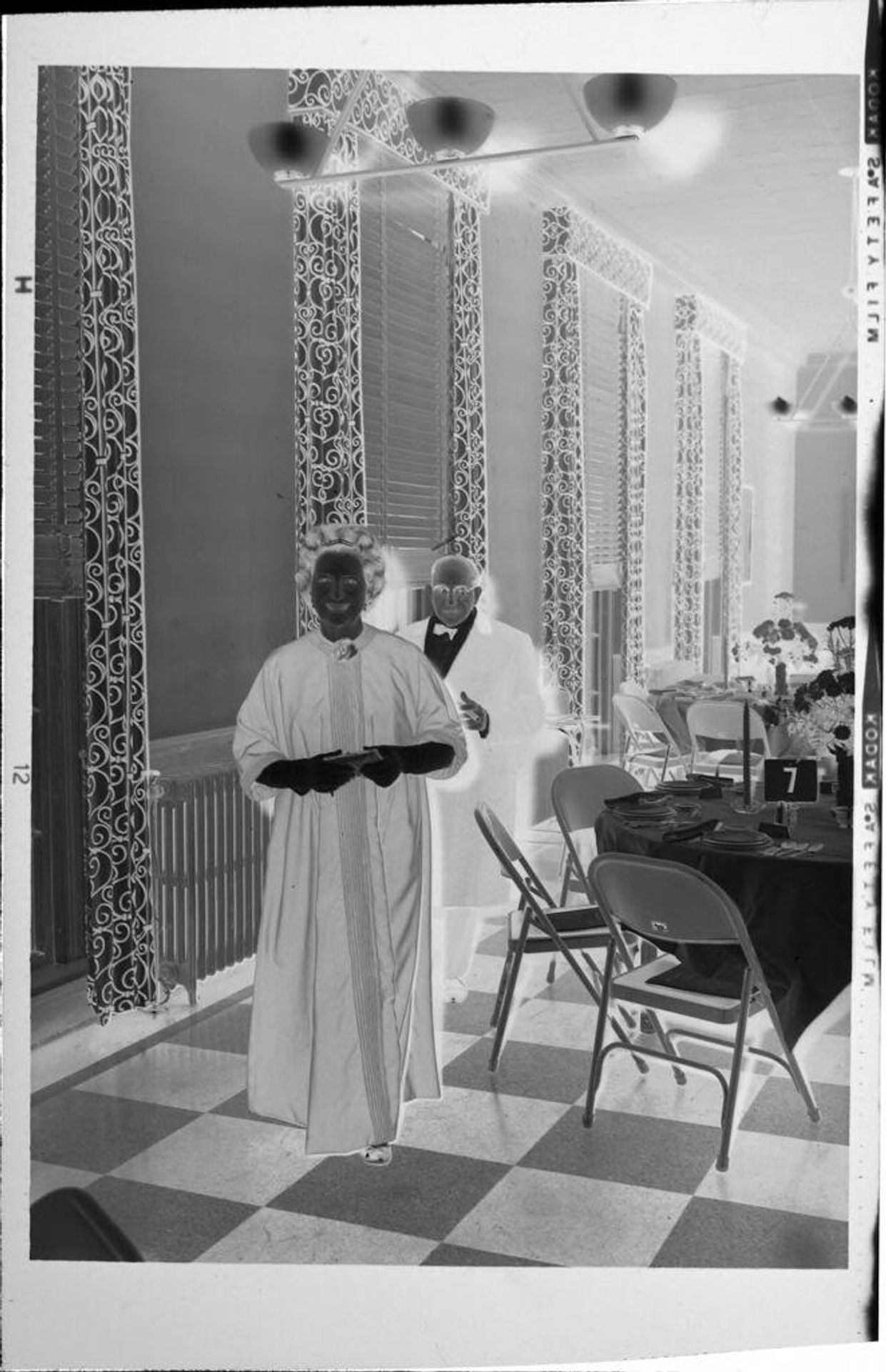 Untitled (man and woman at party) by Robert Burian