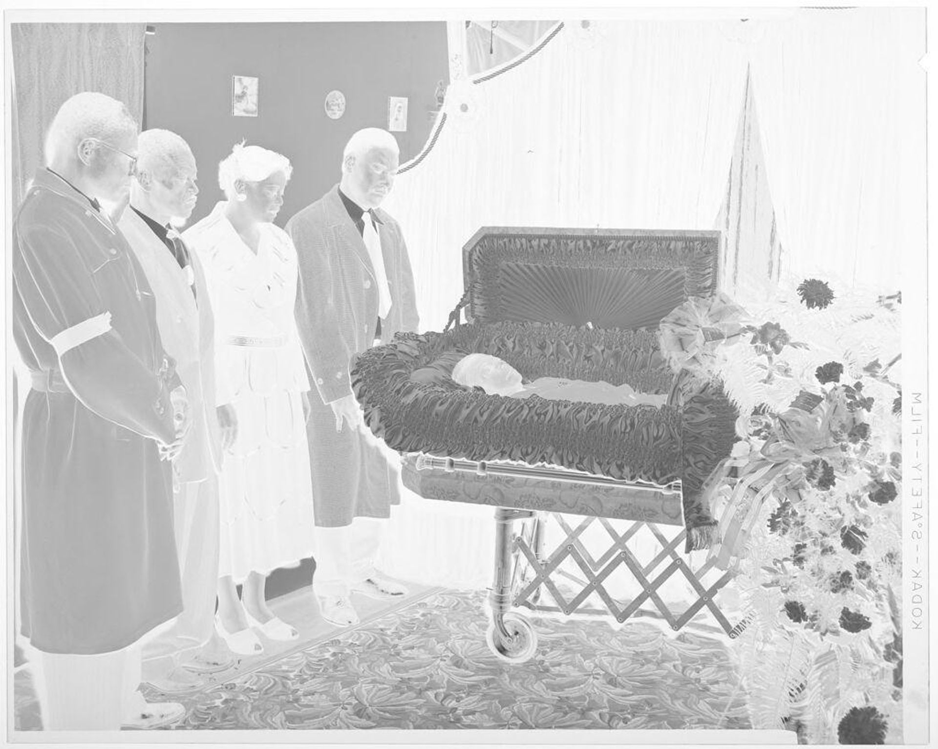 Untitled (mourners beside open casket) by Hamblin Studio