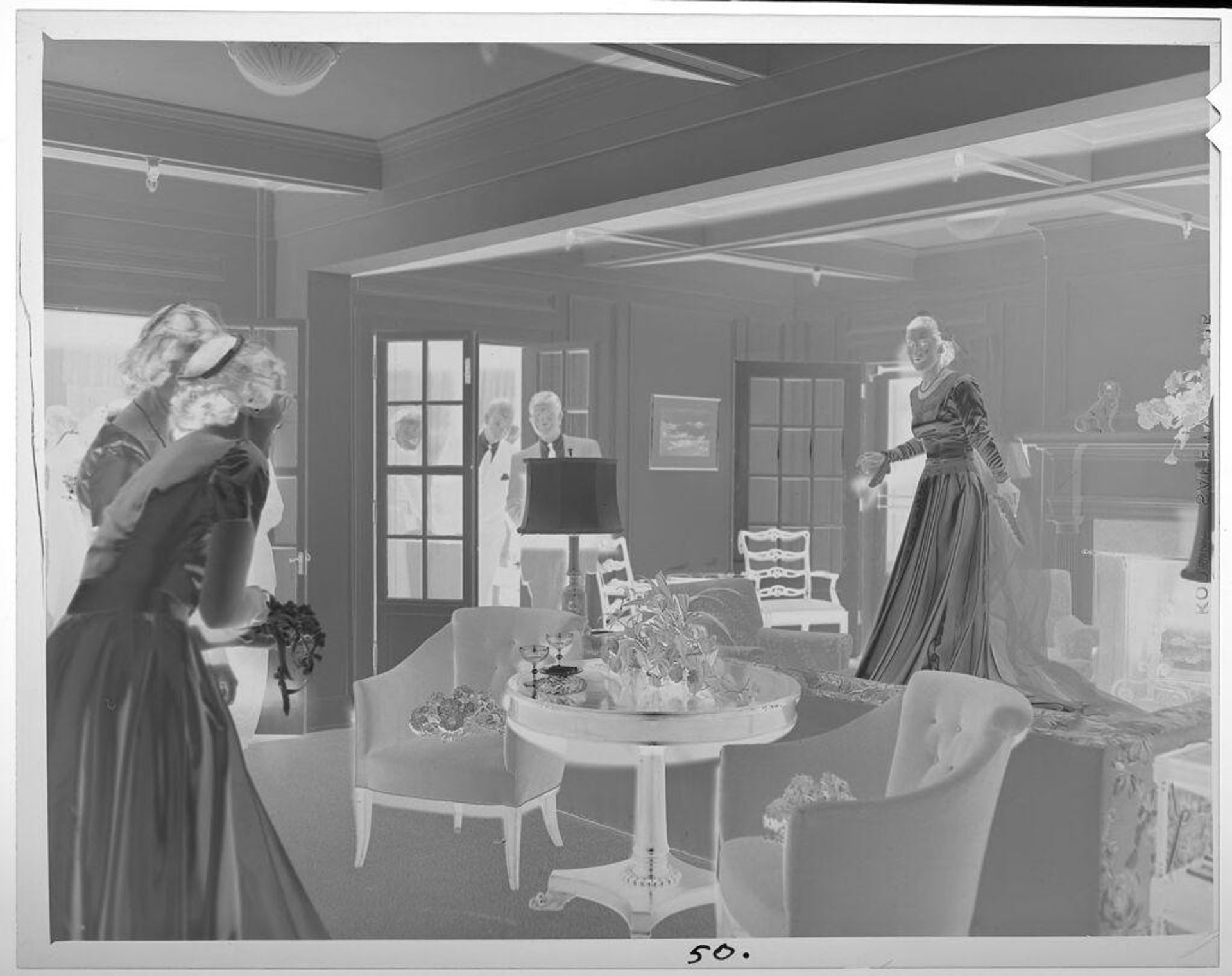 Untitled (bride entering living room, people watching) by Lucian and Mary Brown