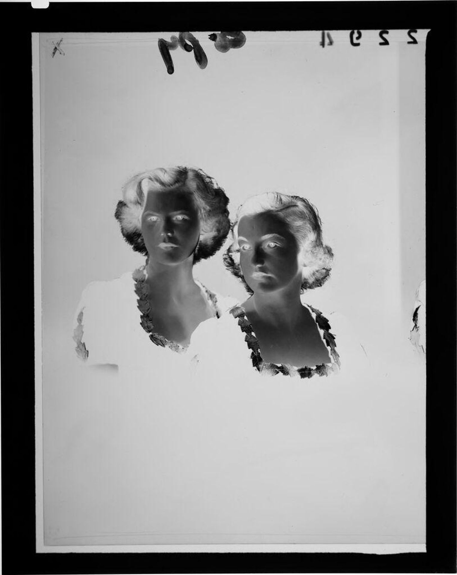 Untitled (studio portrait of two girls wearing dresses with leaf edges) by Martin Schweig